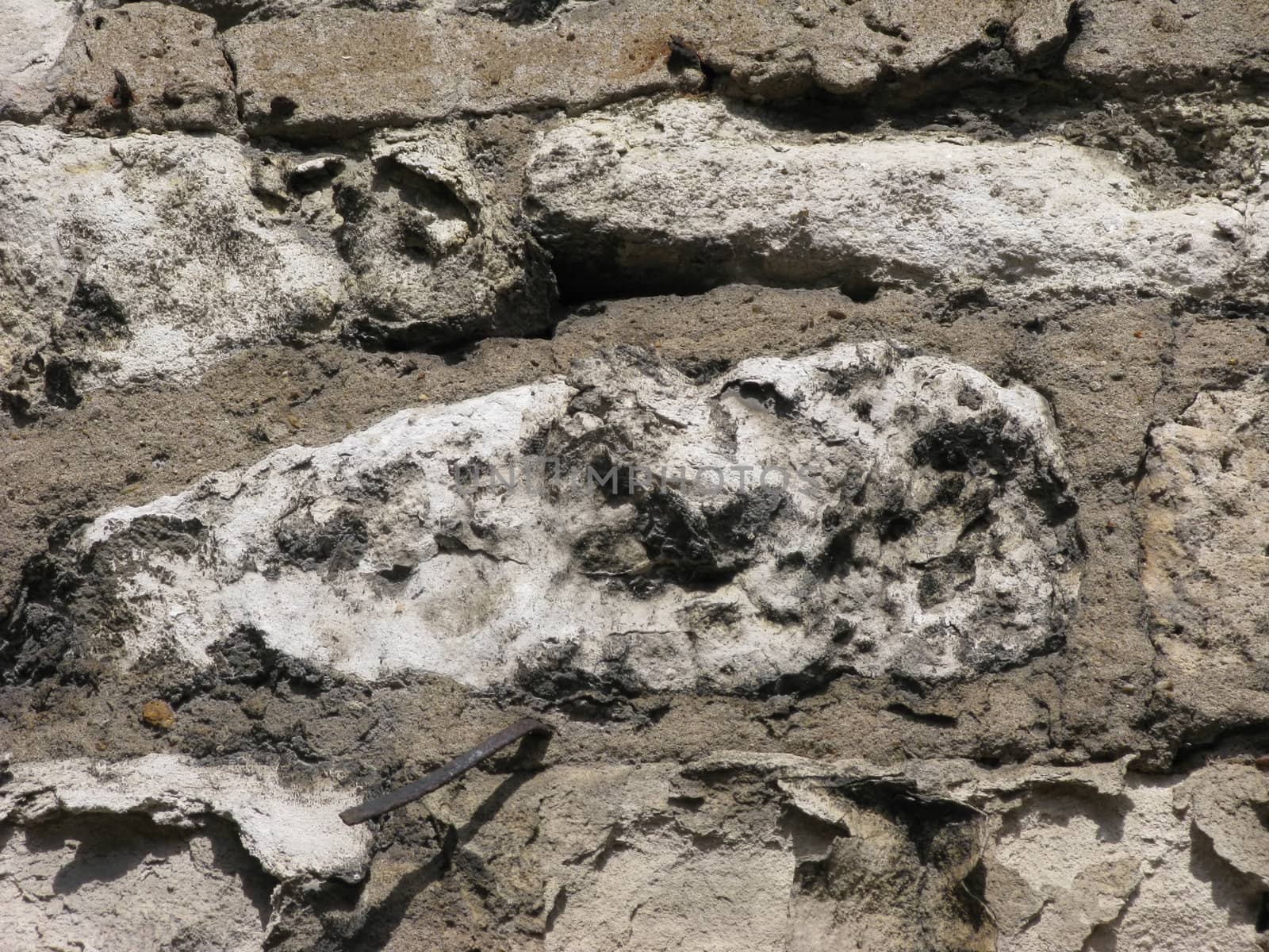 Rough stone wall texture with metal pin by wander