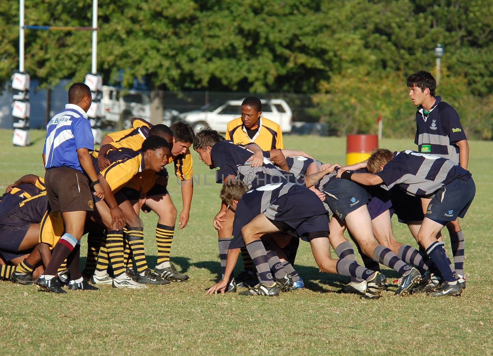 A scrum in a rugby football match between two school teams. (Editorial)