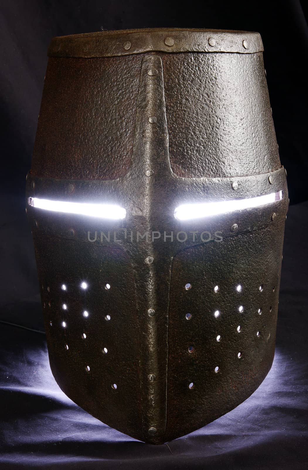 Iron helmet of the medieval knight. Very heavy headdress.