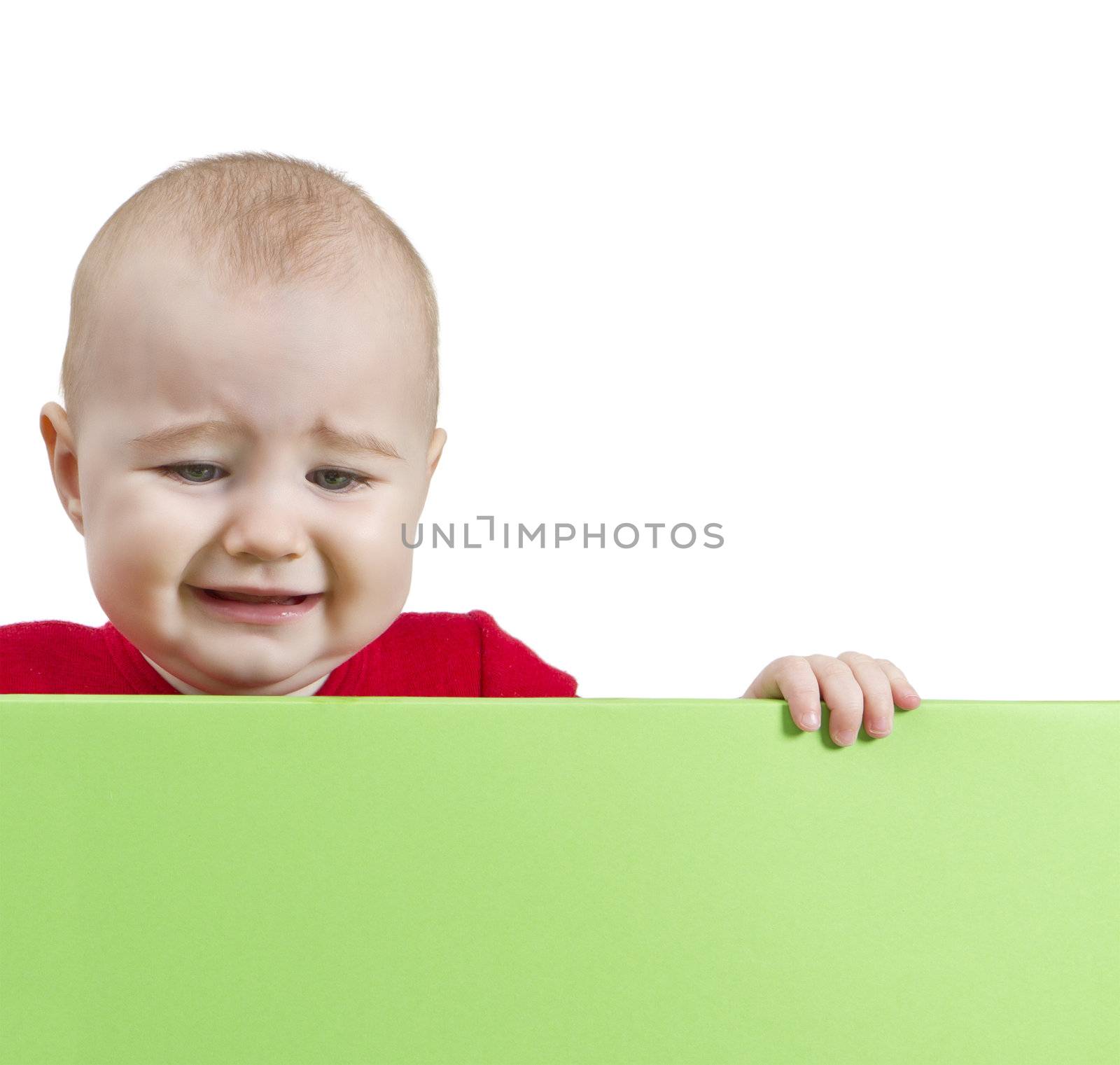 sad young child holding shield. isolate on white background