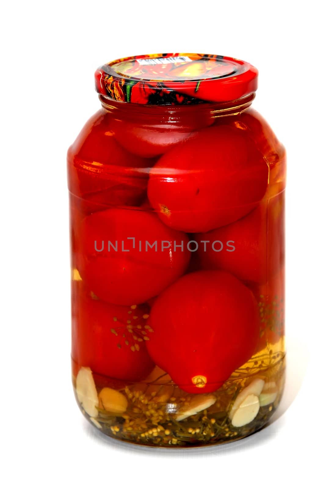 Marinated tomatos in the glass jar