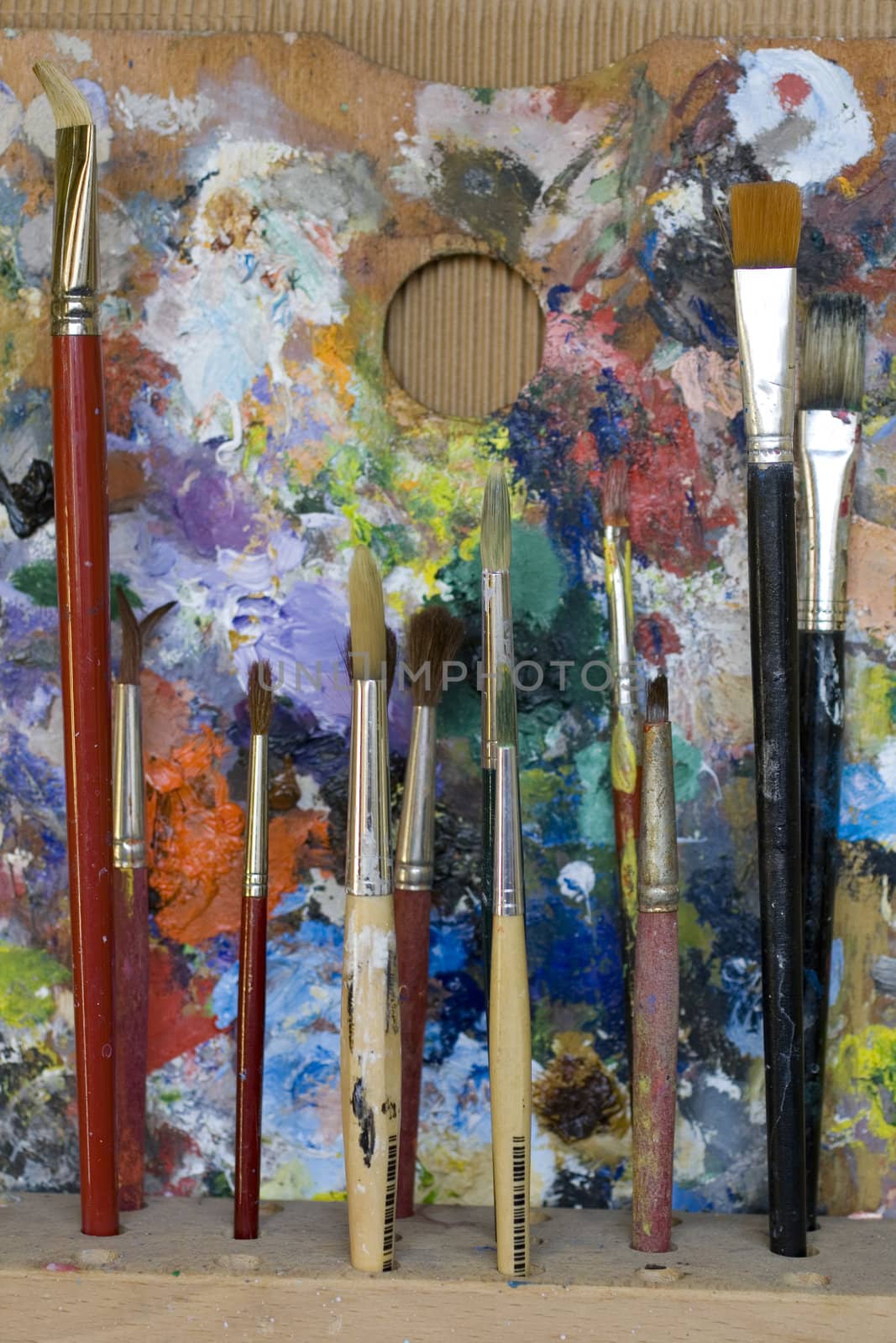 Paintbrushes and palette by bepsimage