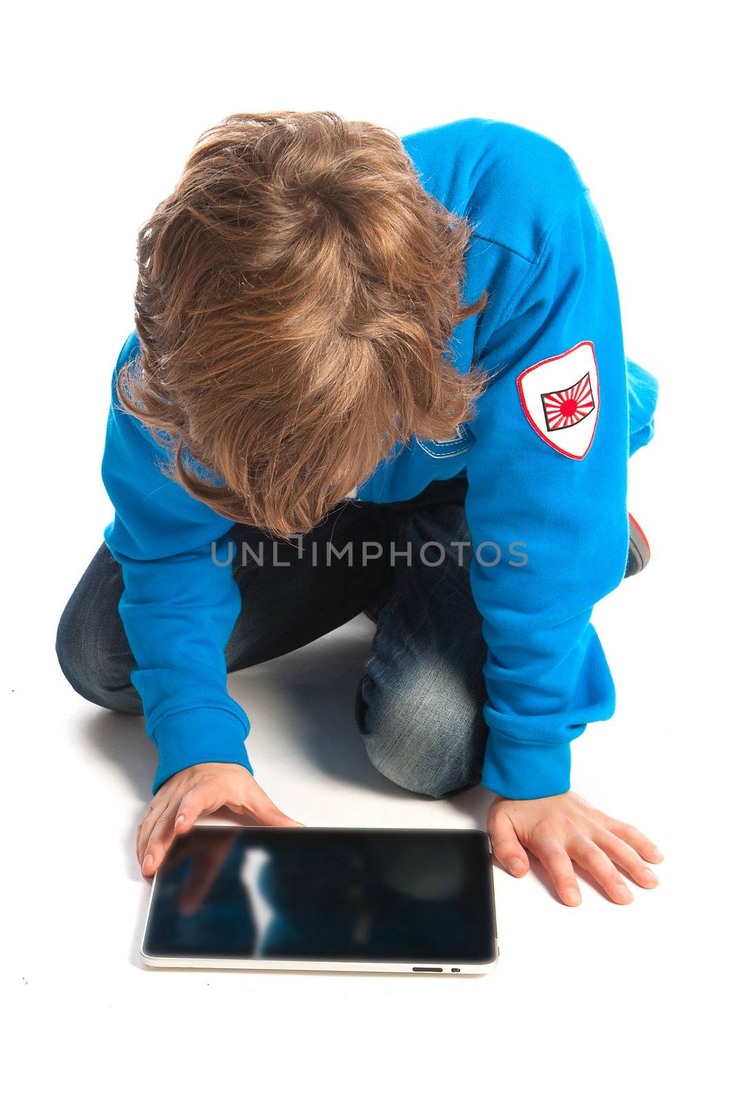 a teenage boy with a tablet