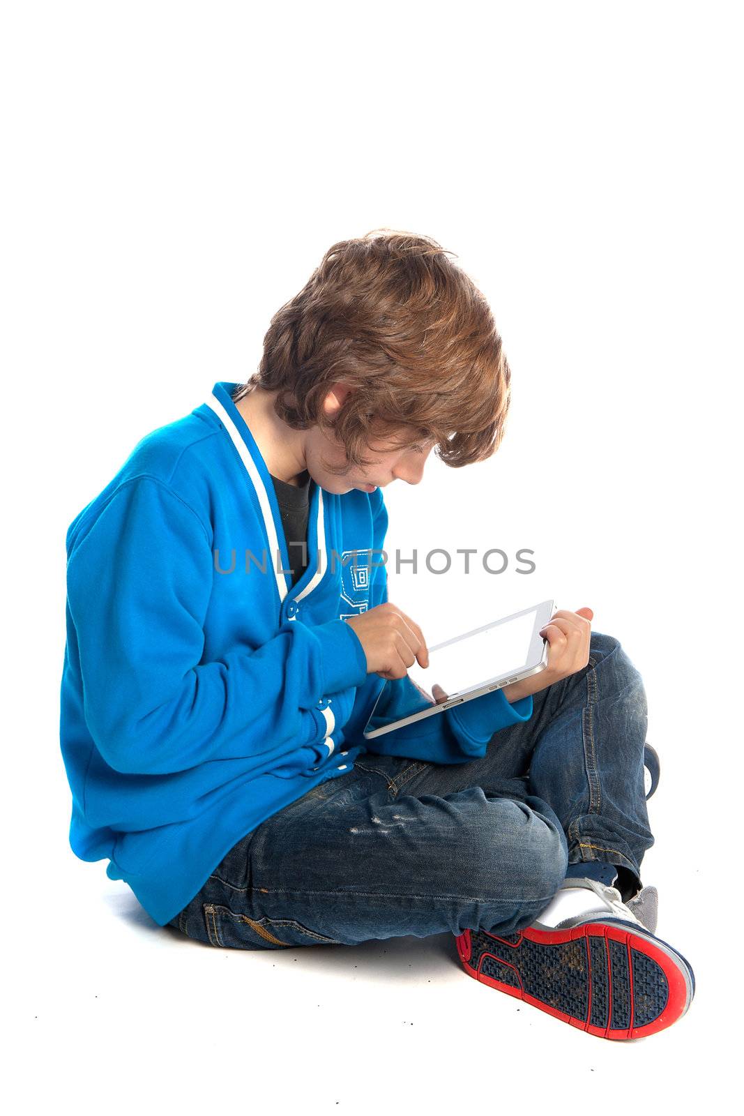 a teenage boy with a tablet
