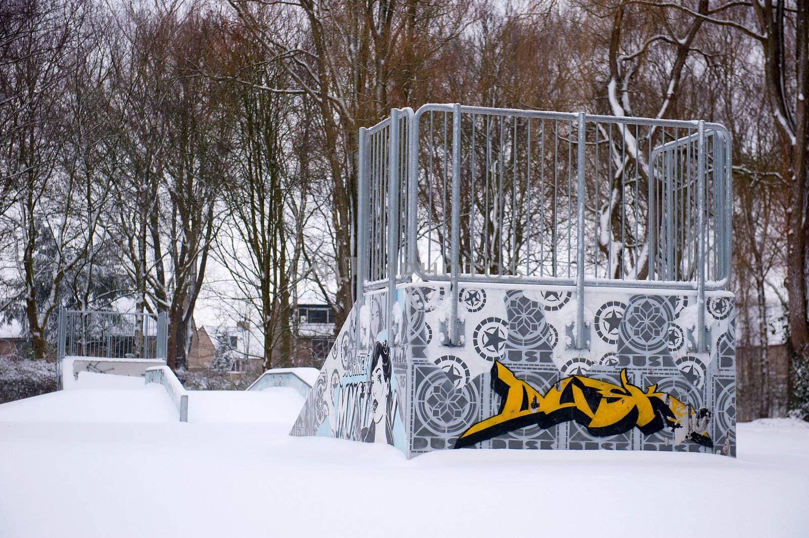 a skating rink with grafitti in the snow