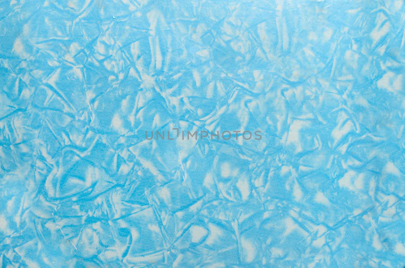 Chaotic blue texture over the grunge plastic background