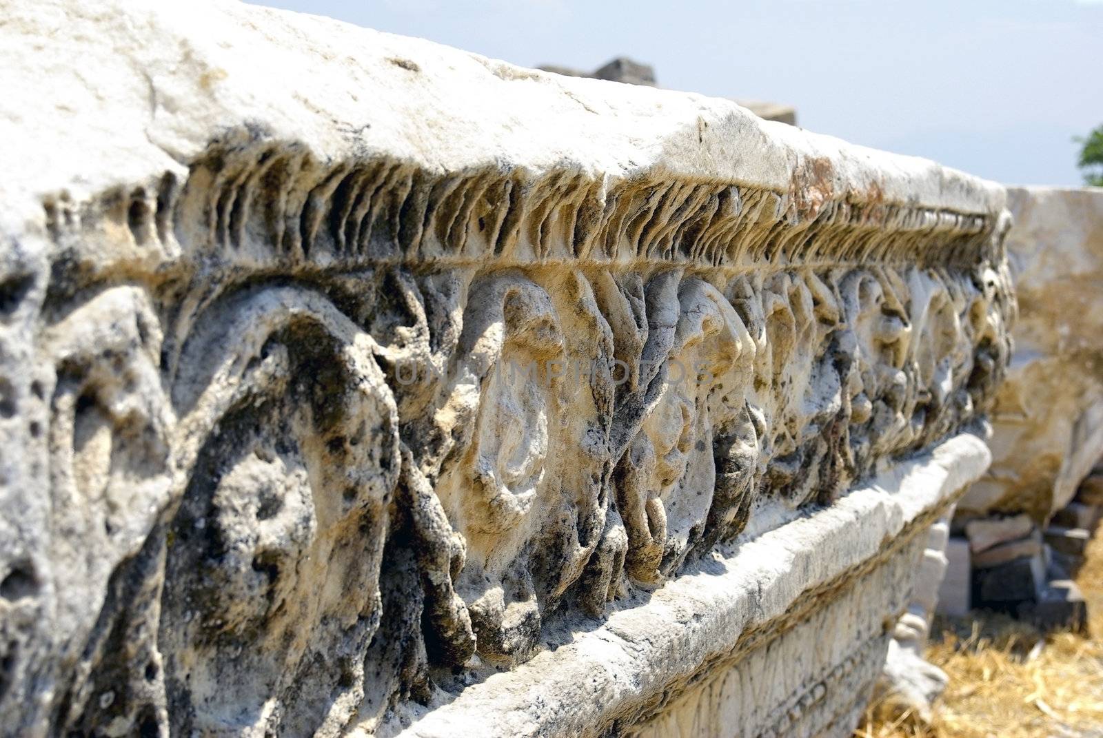 Ancient marble ruins with ornamental decoration. Hierapolis - Pa by borodaev