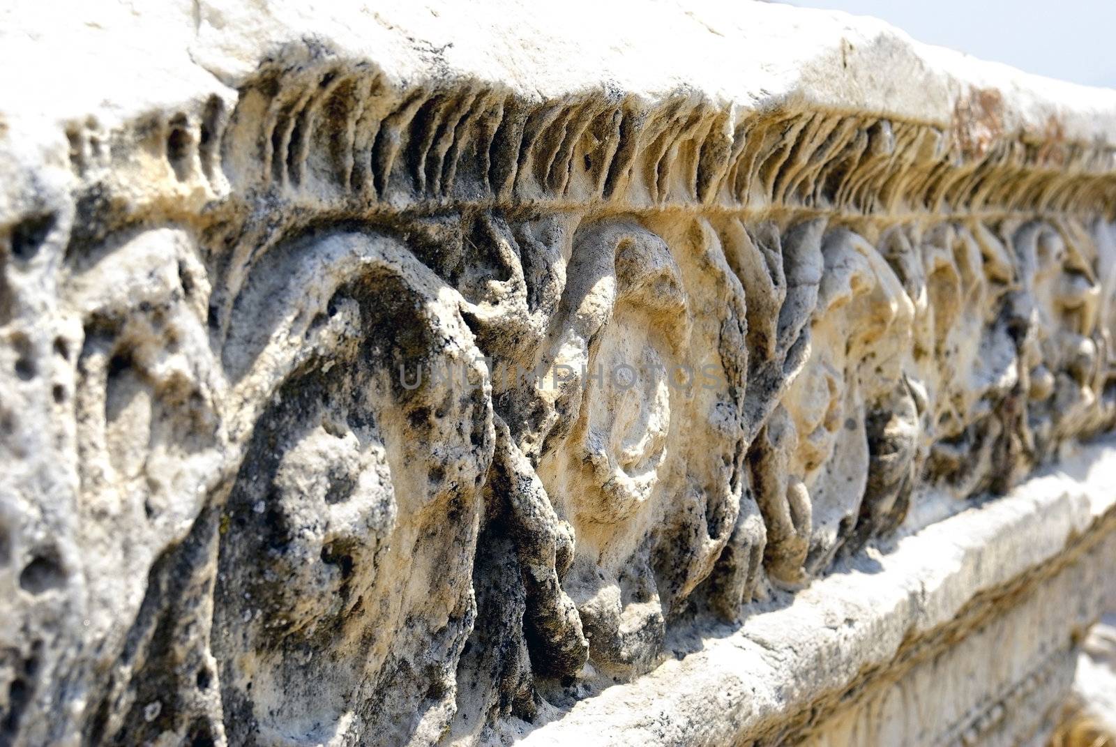 Ancient marble ruins with ornamental decoration. Hierapolis - Pamukkale, Turkey.