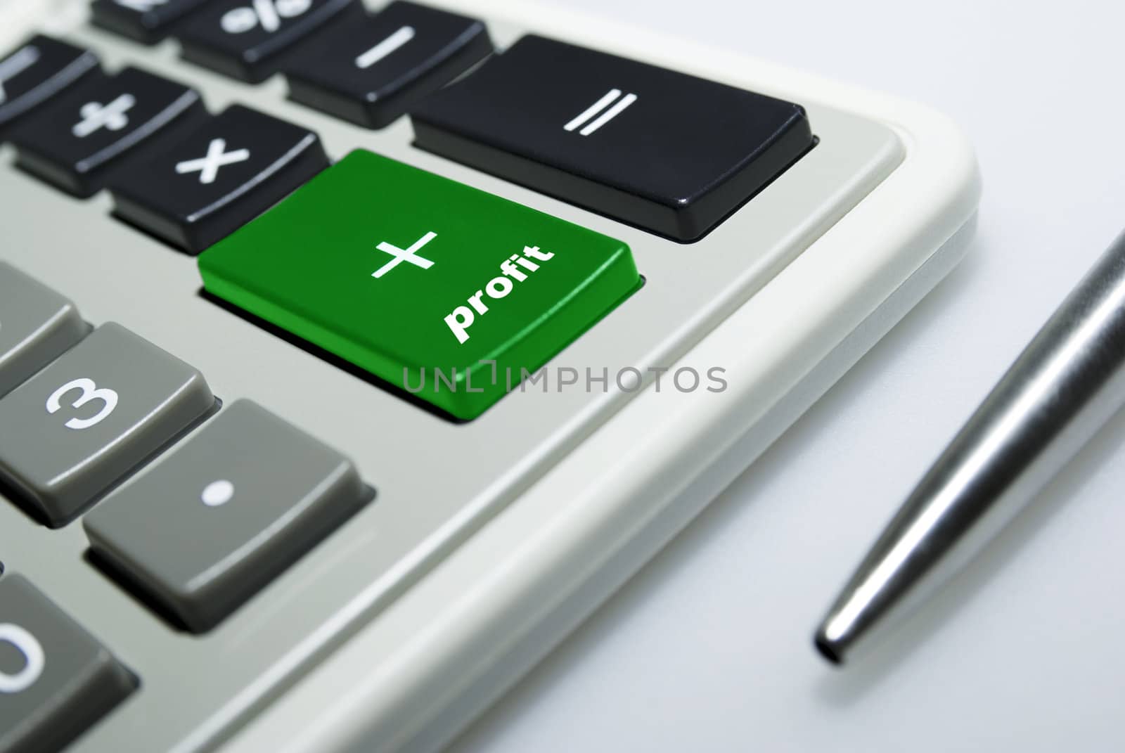 Calculator and pen on white background.