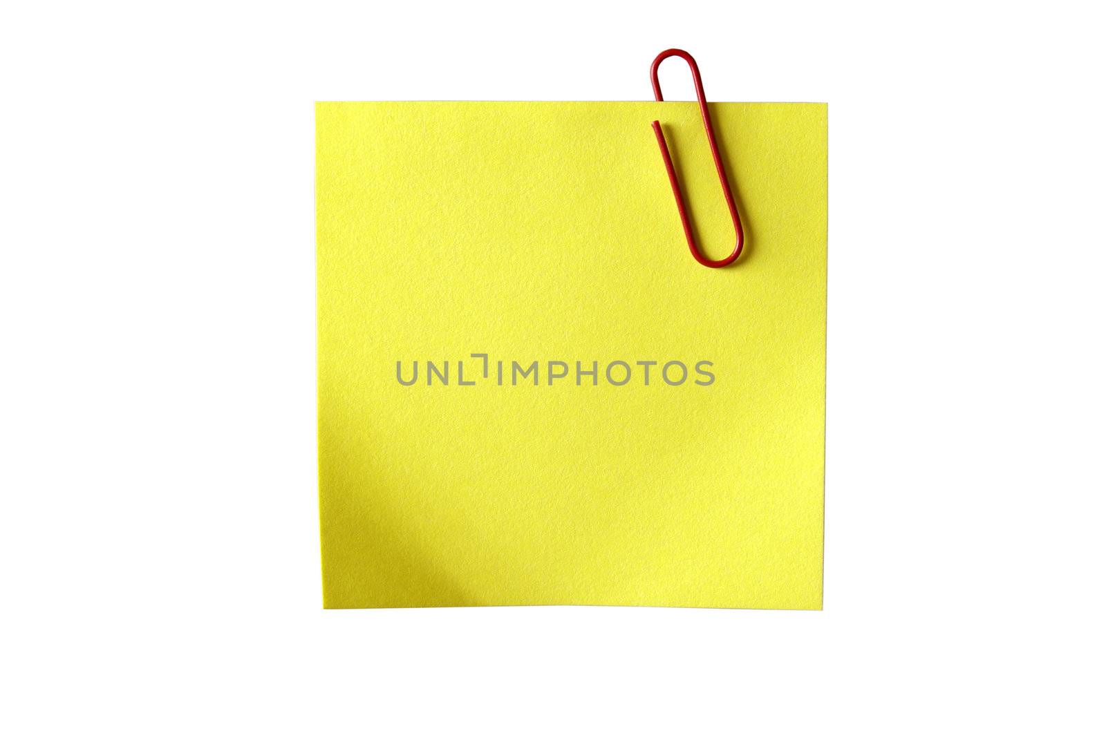 Yellow sticky paper with red clip. Isolated on white background  by borodaev