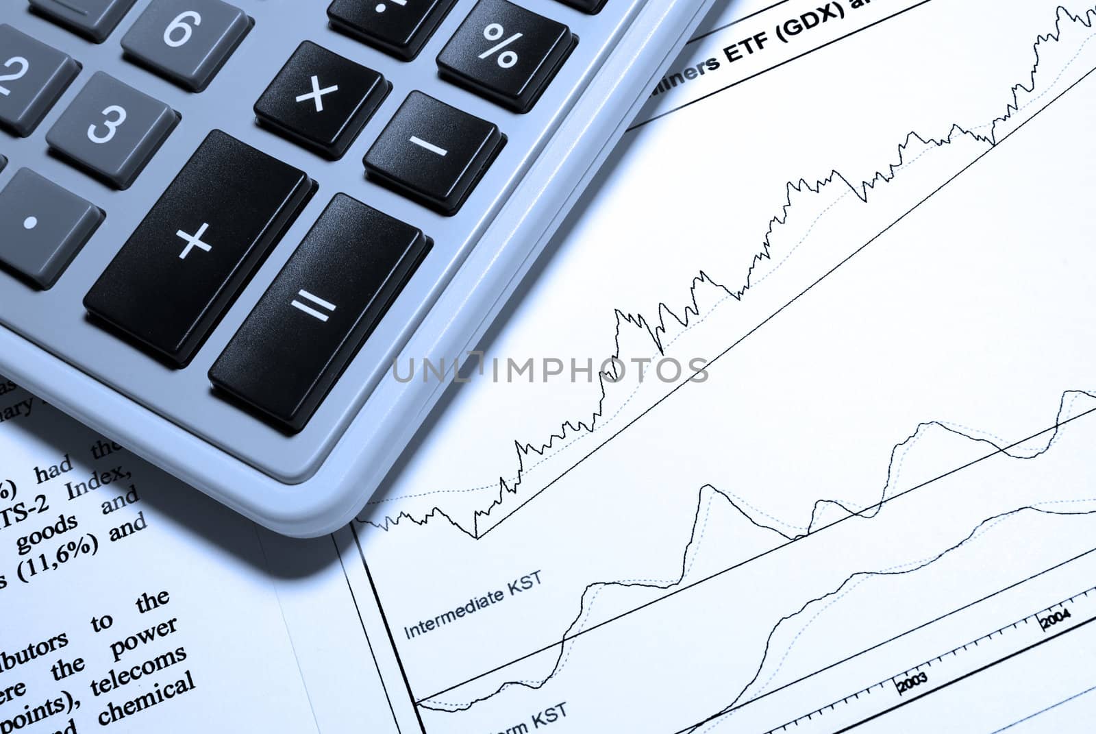 Calculator and printed business report.