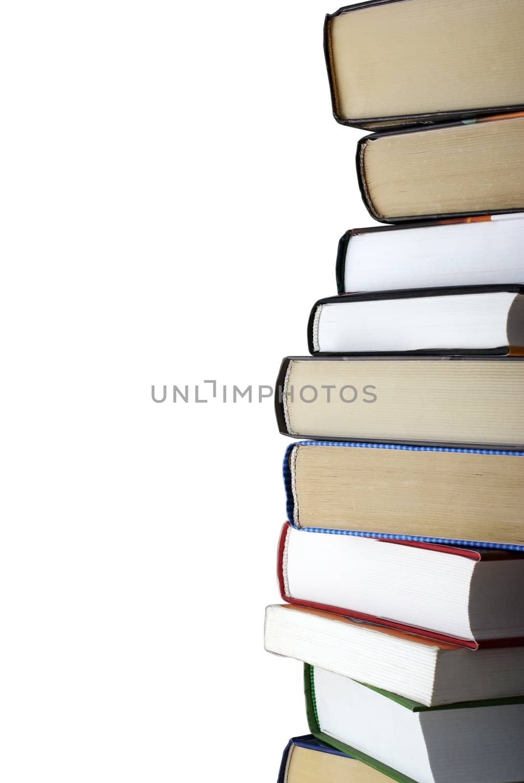 Vertical stack of different books isolated on white background. Clipping path.