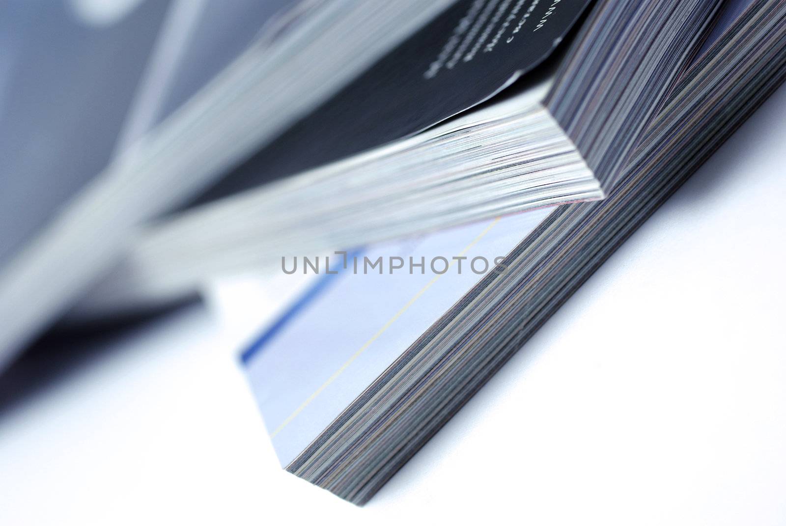 Stacked magazines isolated on white background.