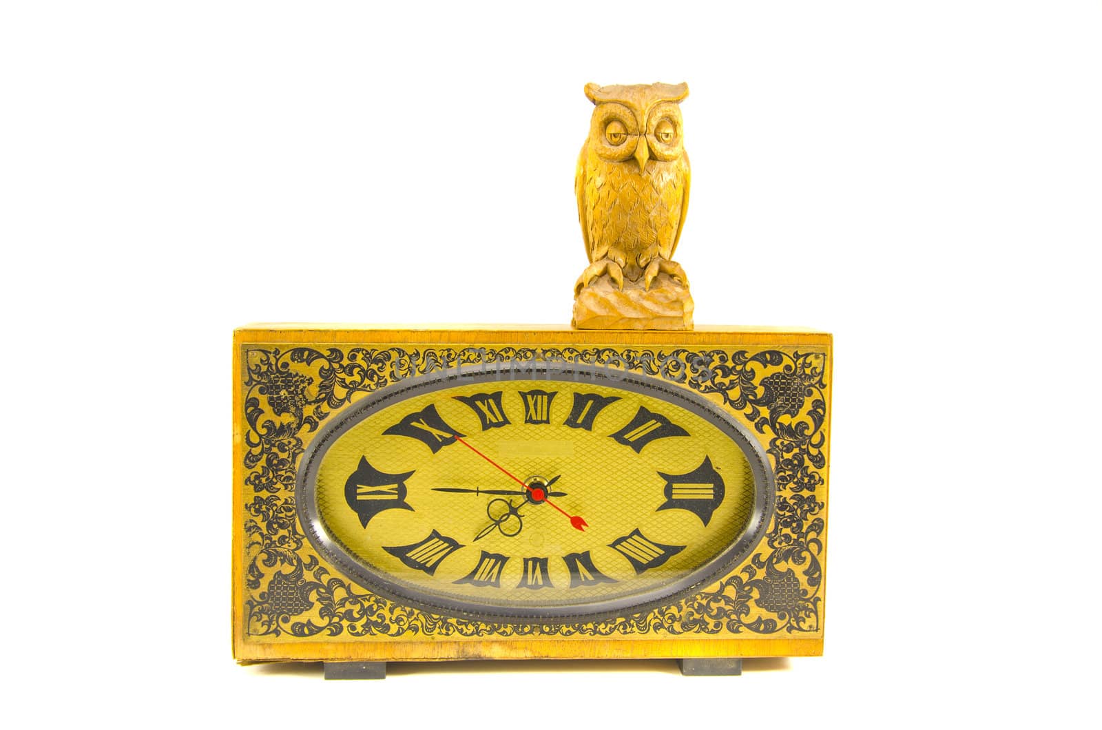 vintage clock and wooden owl sculpture isolated on white background