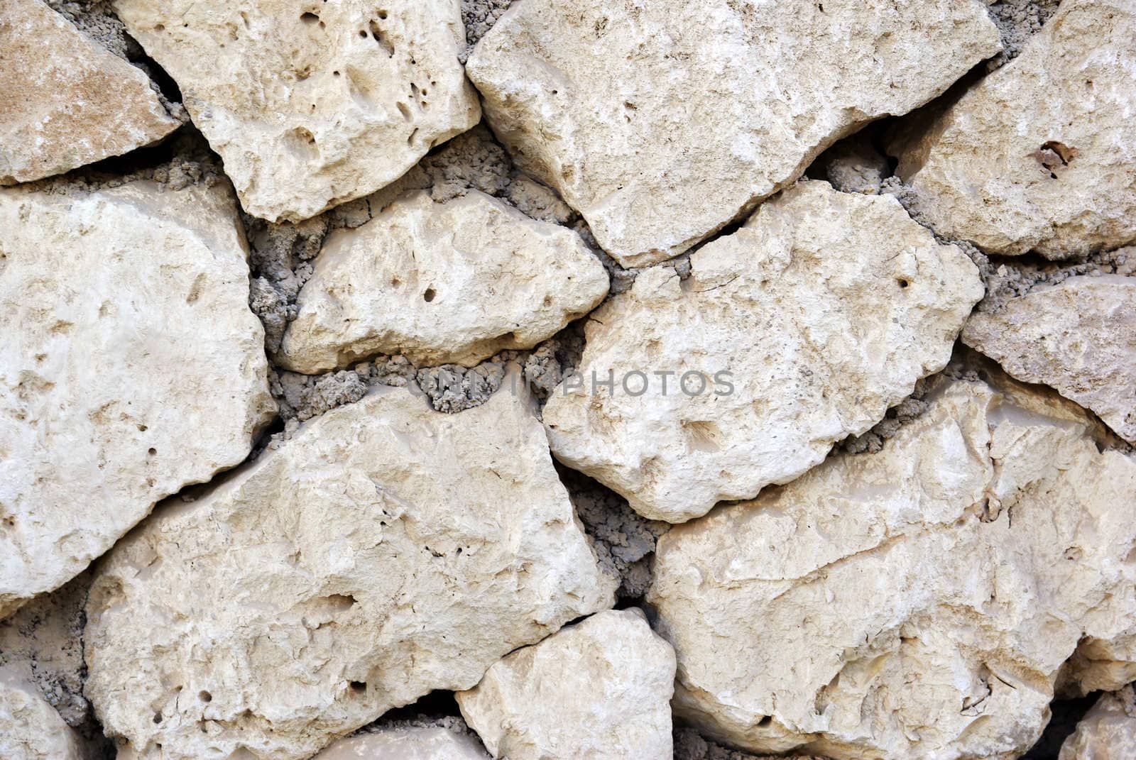 Close-up wall made of stone. Textured background. by borodaev