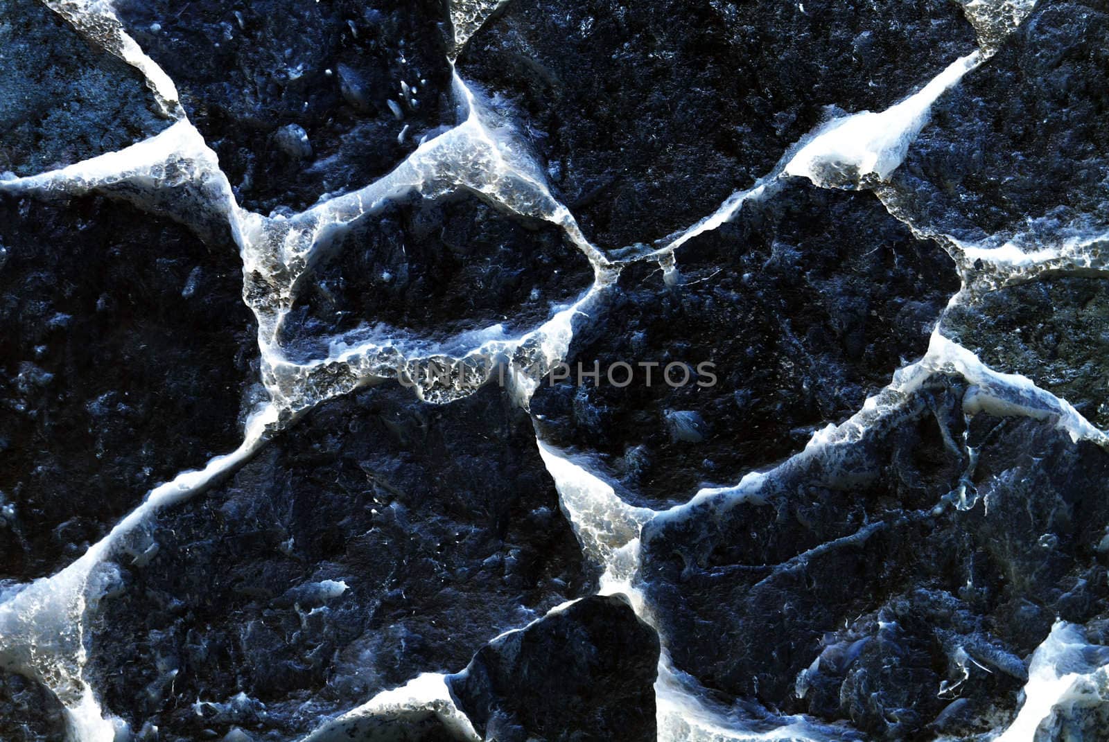 Blue abstract ghostly wall made of stone close-up. Textured back by borodaev