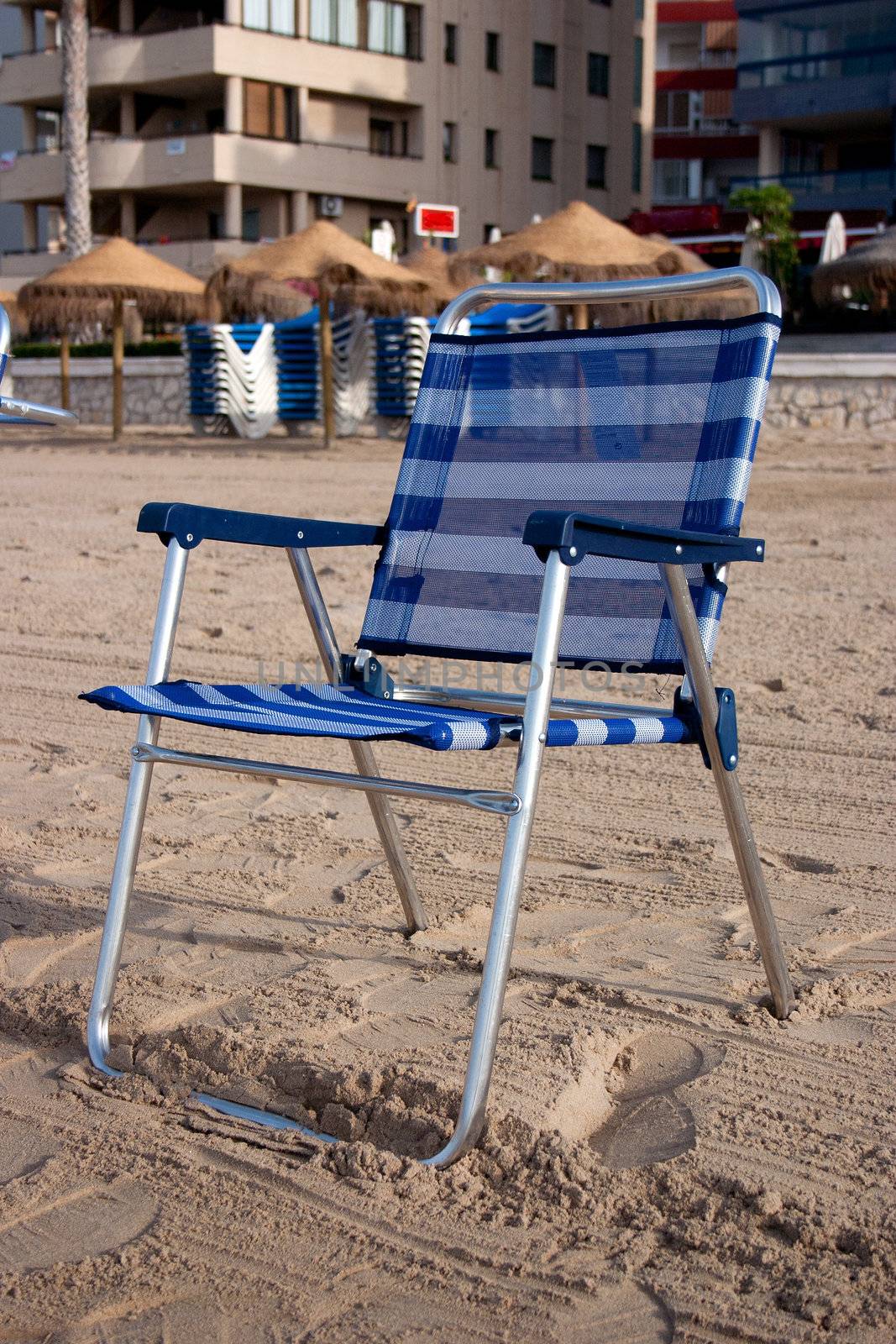 Blue chair on the sand of the beach