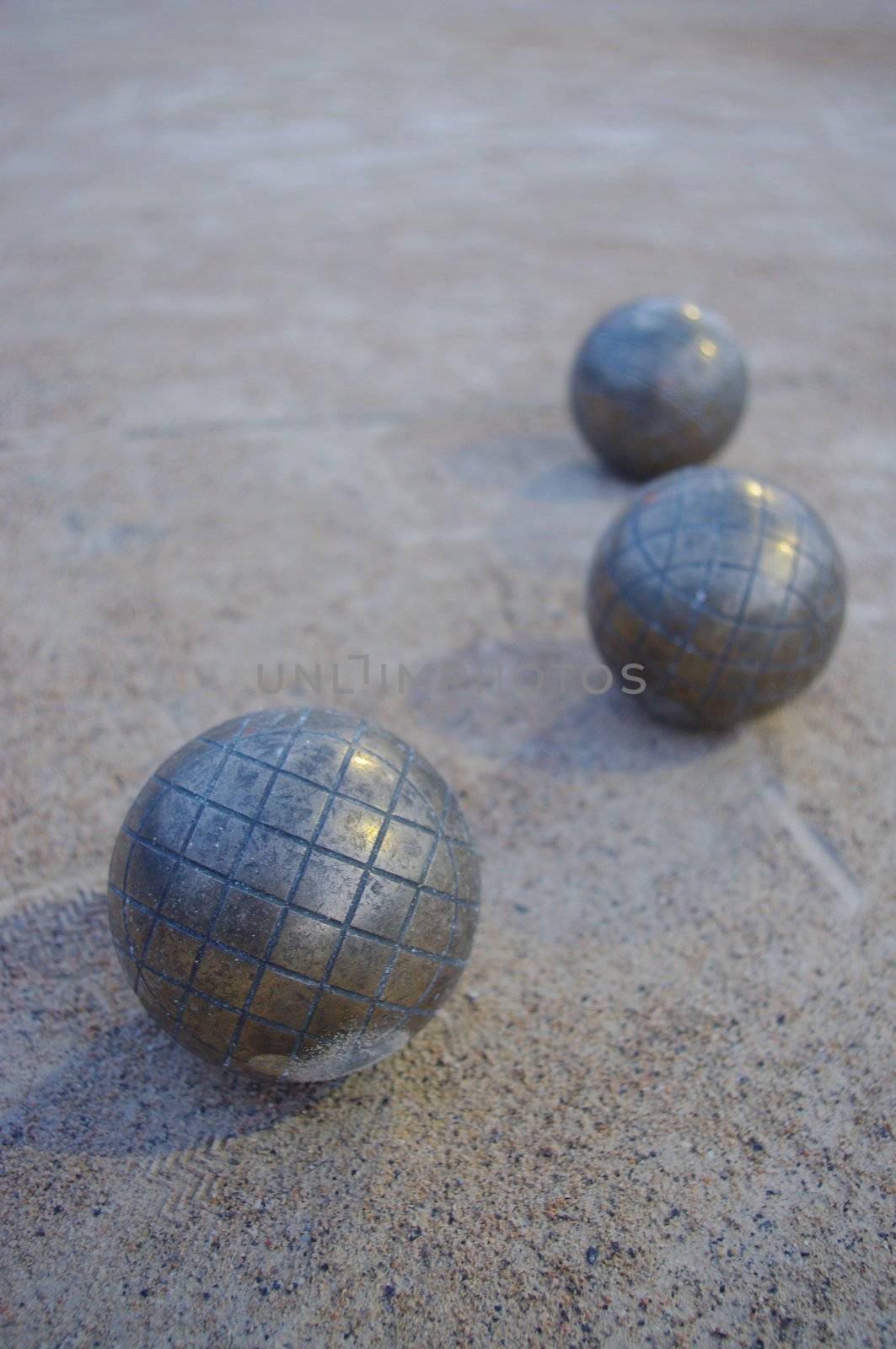 Metal spheres for game in boccia on sand