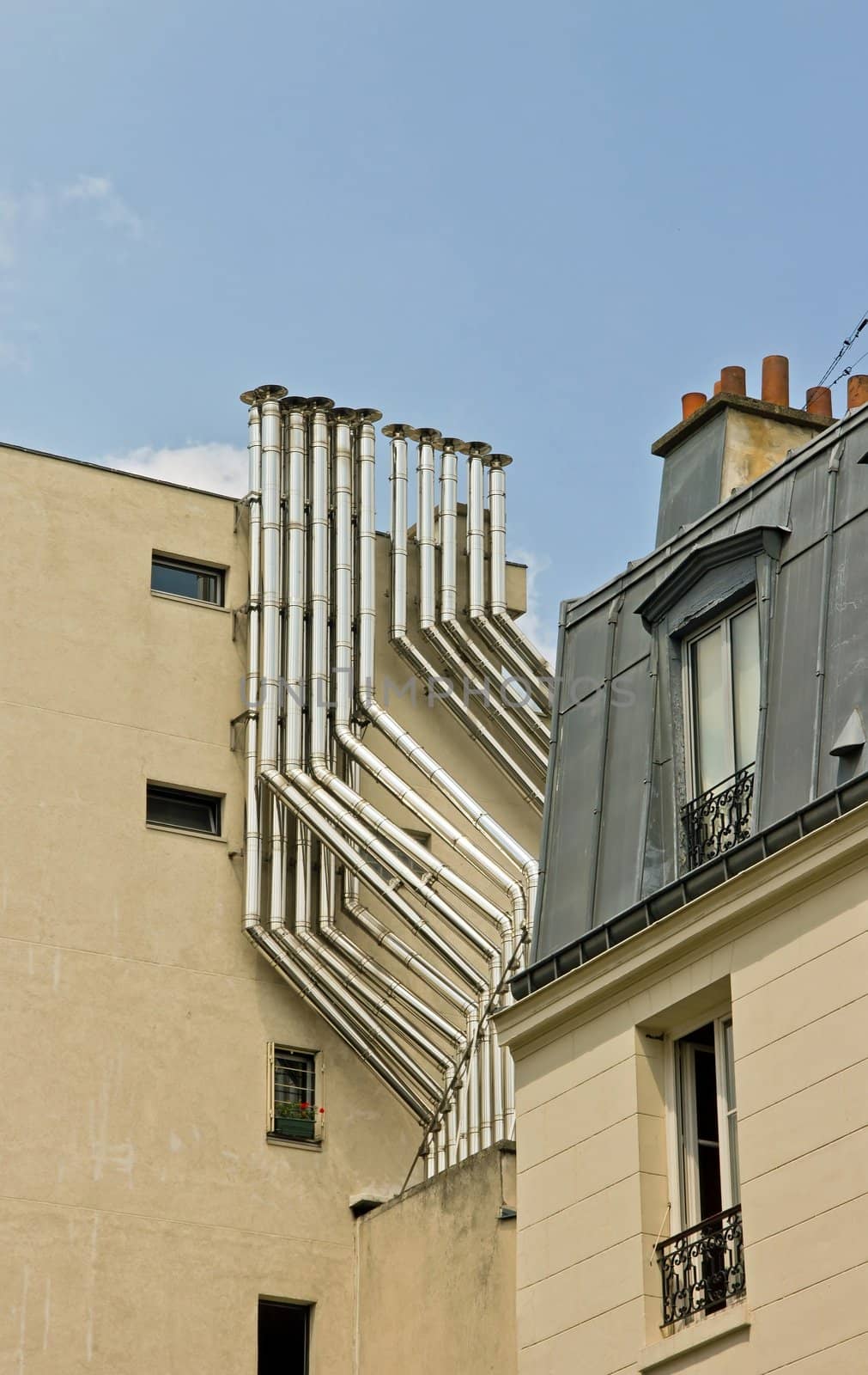 metal chimney on a building in town (Paris France)