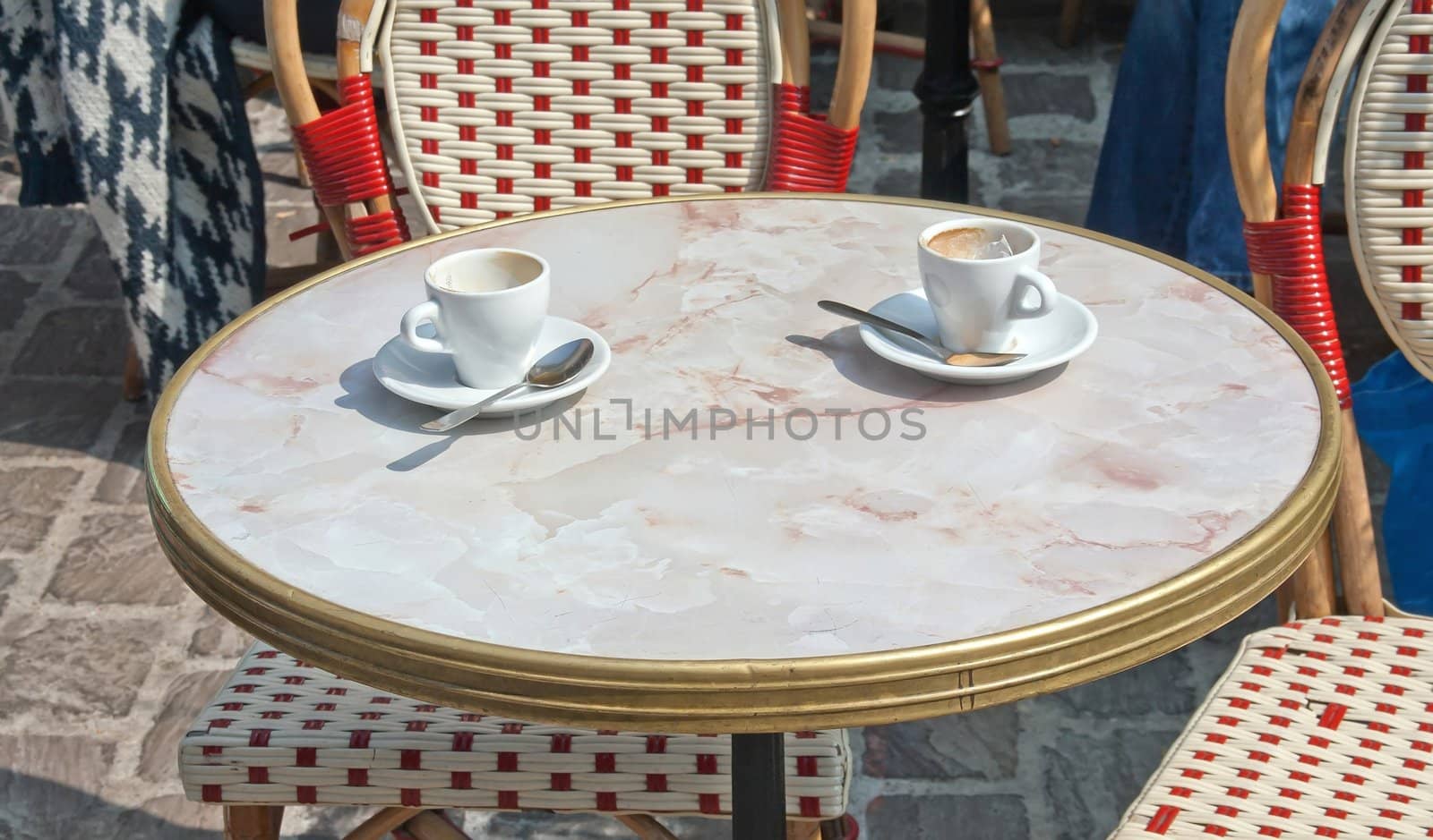 empty coffee cups on the table on the terrace (France)