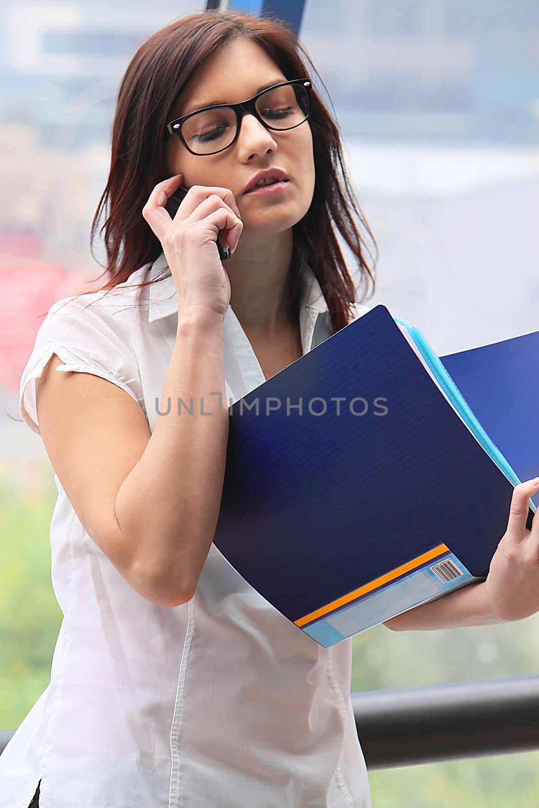 Portrait of the beautiful and young business woman