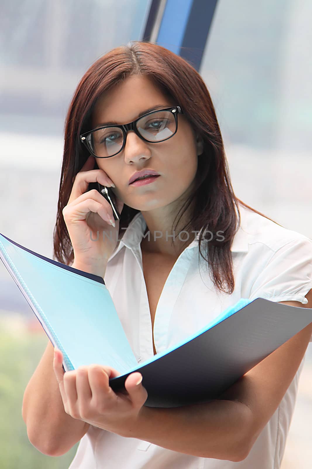 Portrait of the beautiful and young business woman