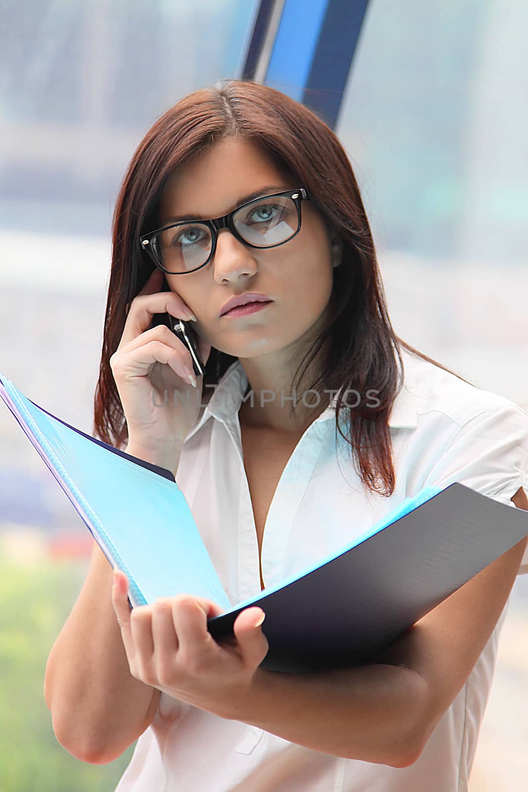 Portrait of the beautiful and young business woman