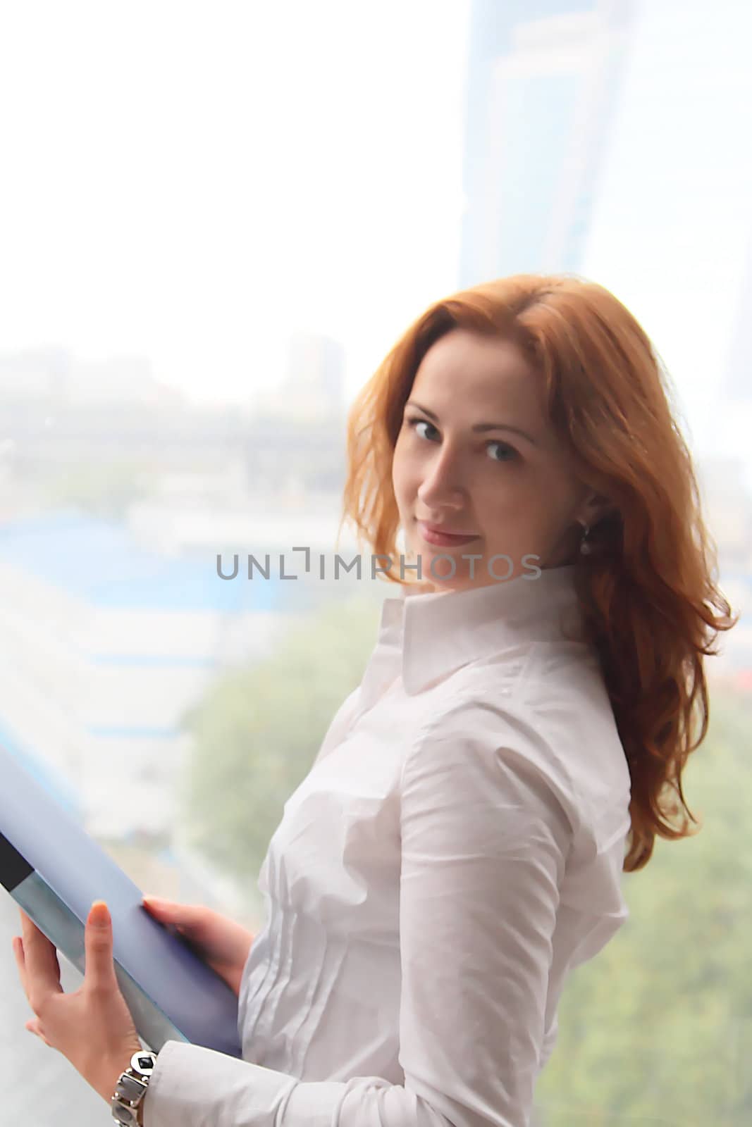 Portrait of the beautiful and young business woman