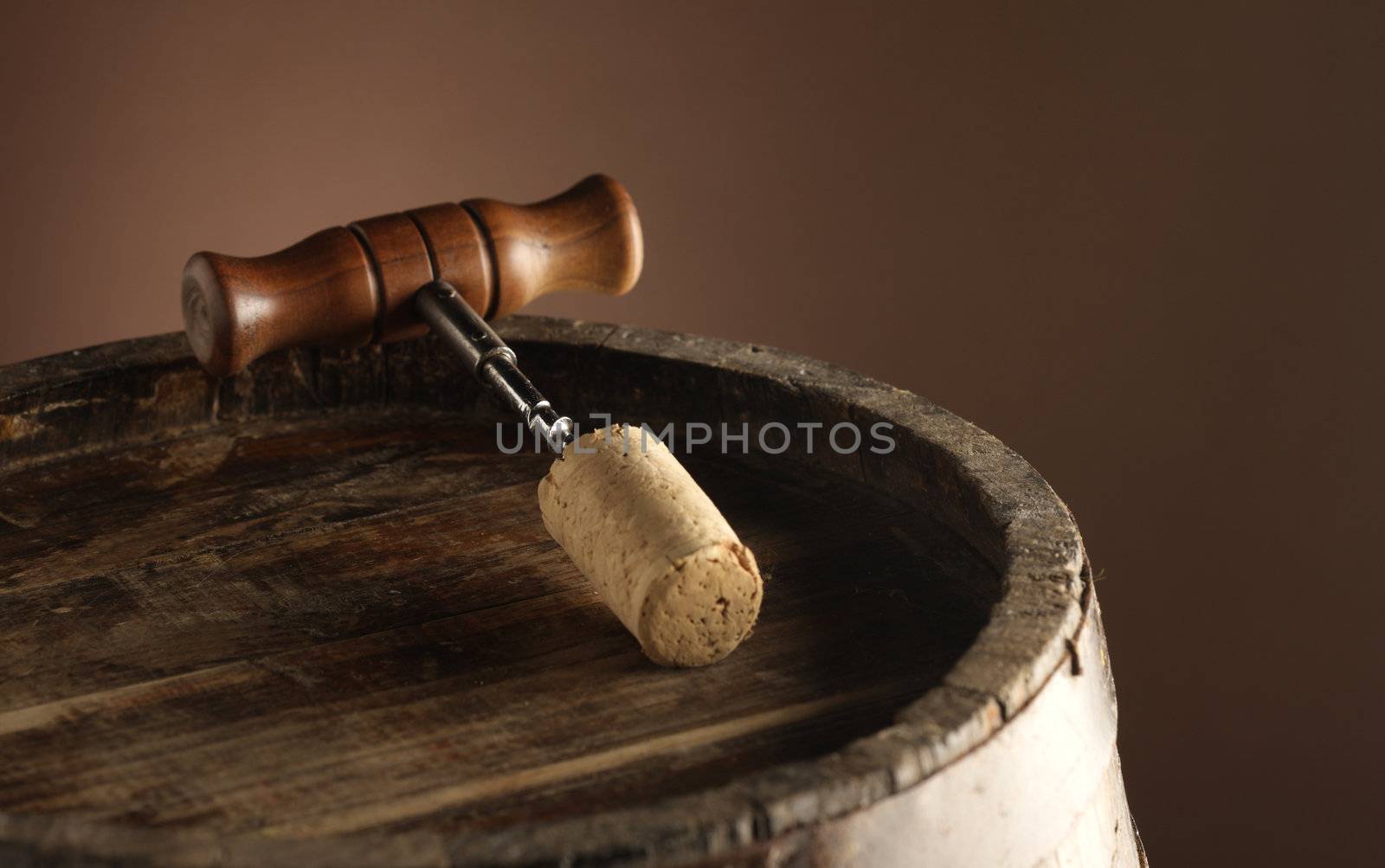 corkscrew and wooden barrel