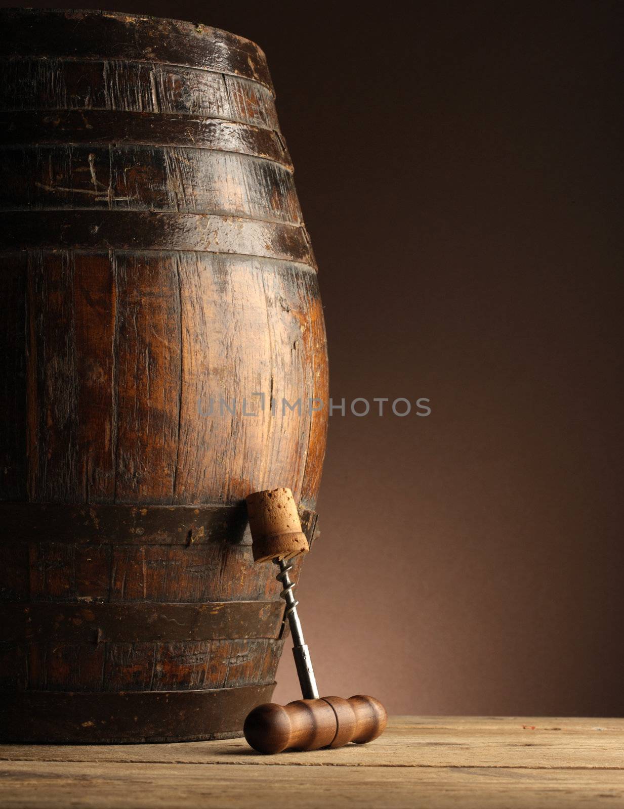 corkscrew and wooden barrel