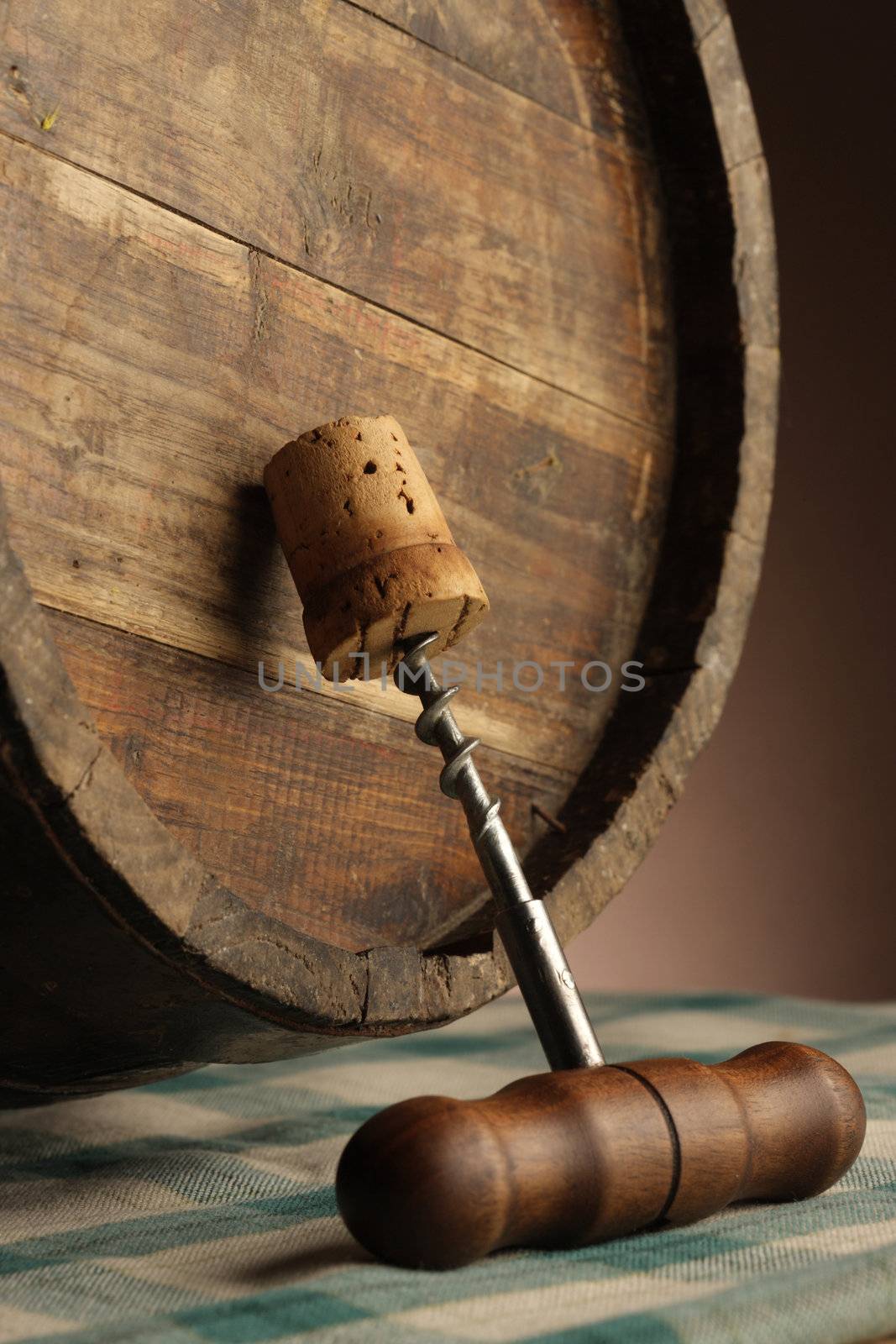 corkscrew and wooden barrel