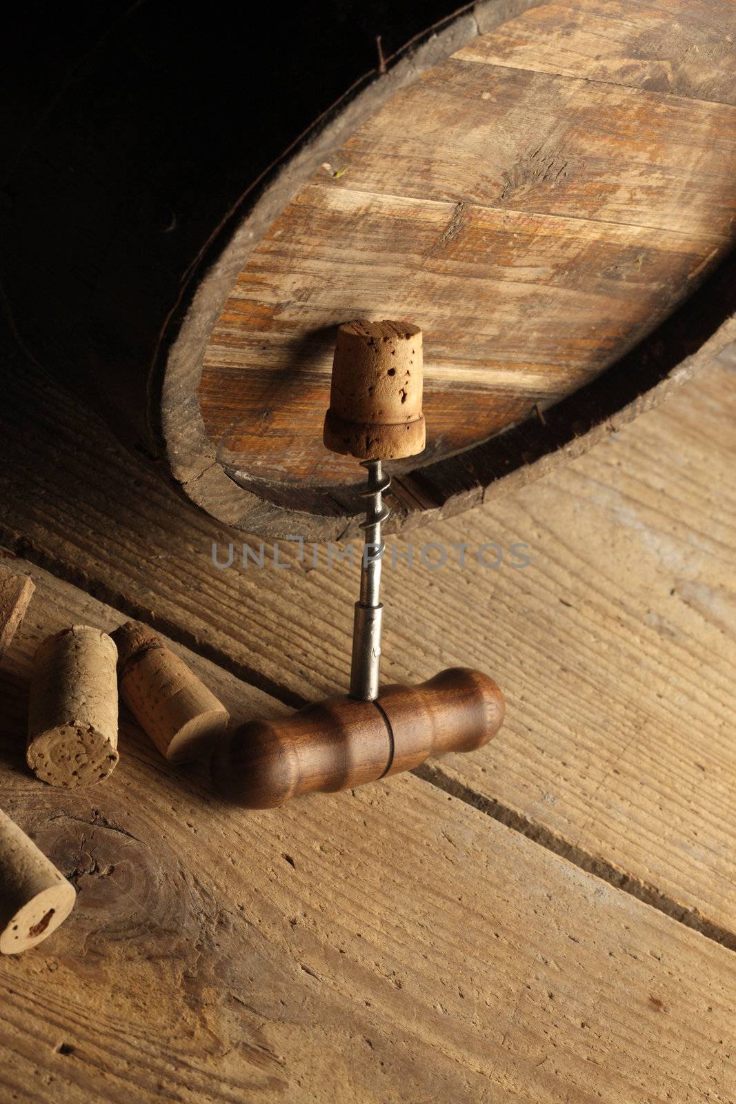corkscrew and wooden barrel