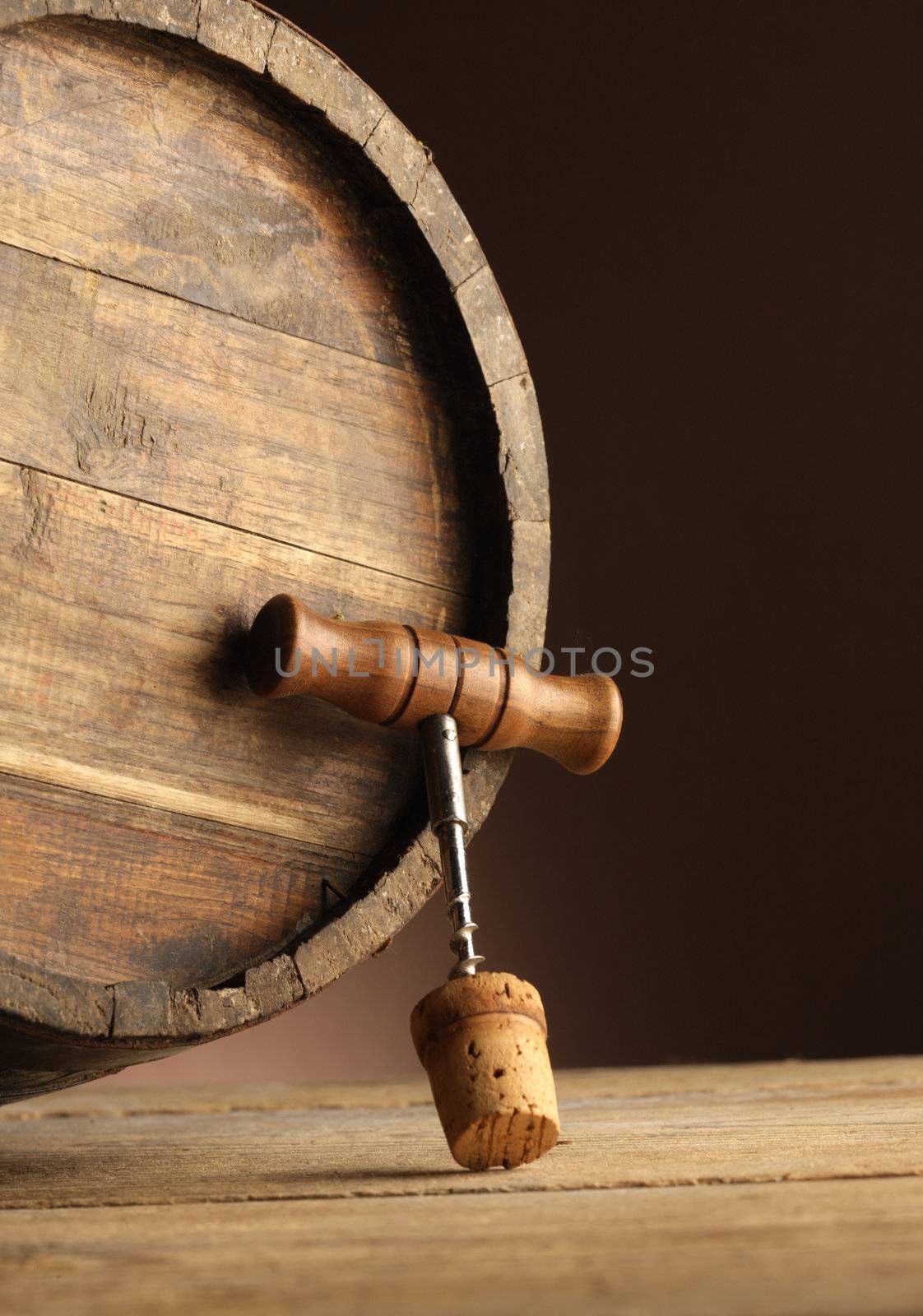 corkscrew and wooden barrel