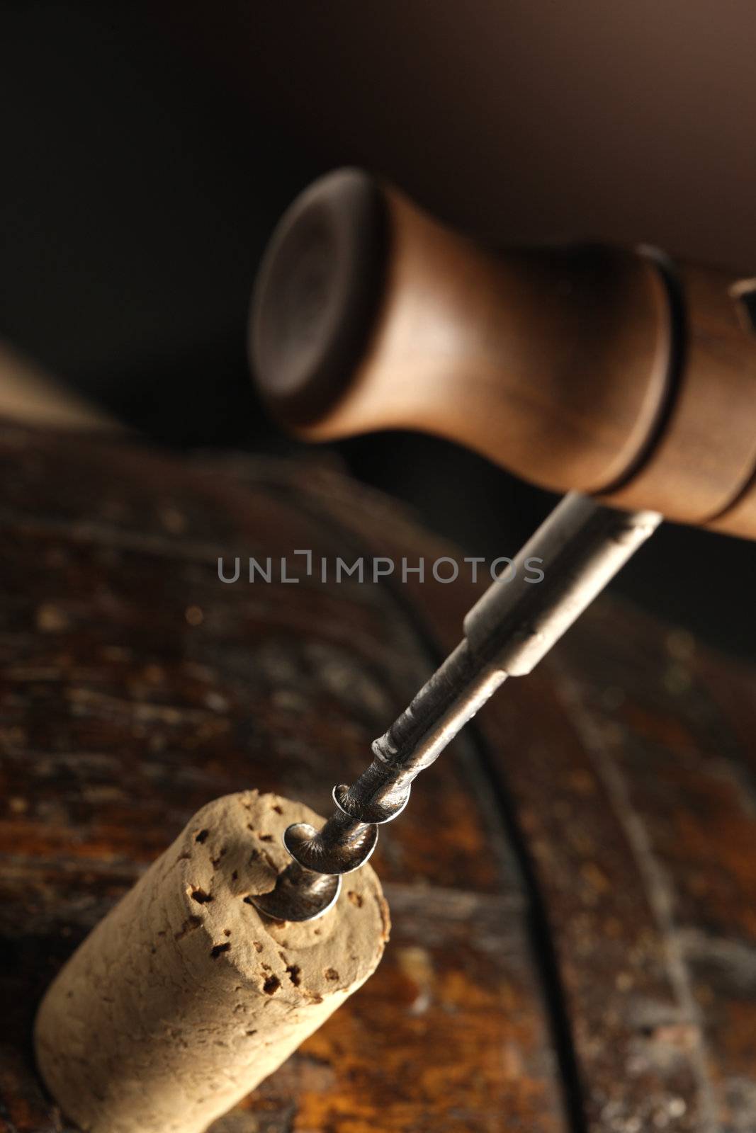 corkscrew and wooden barrel, close up