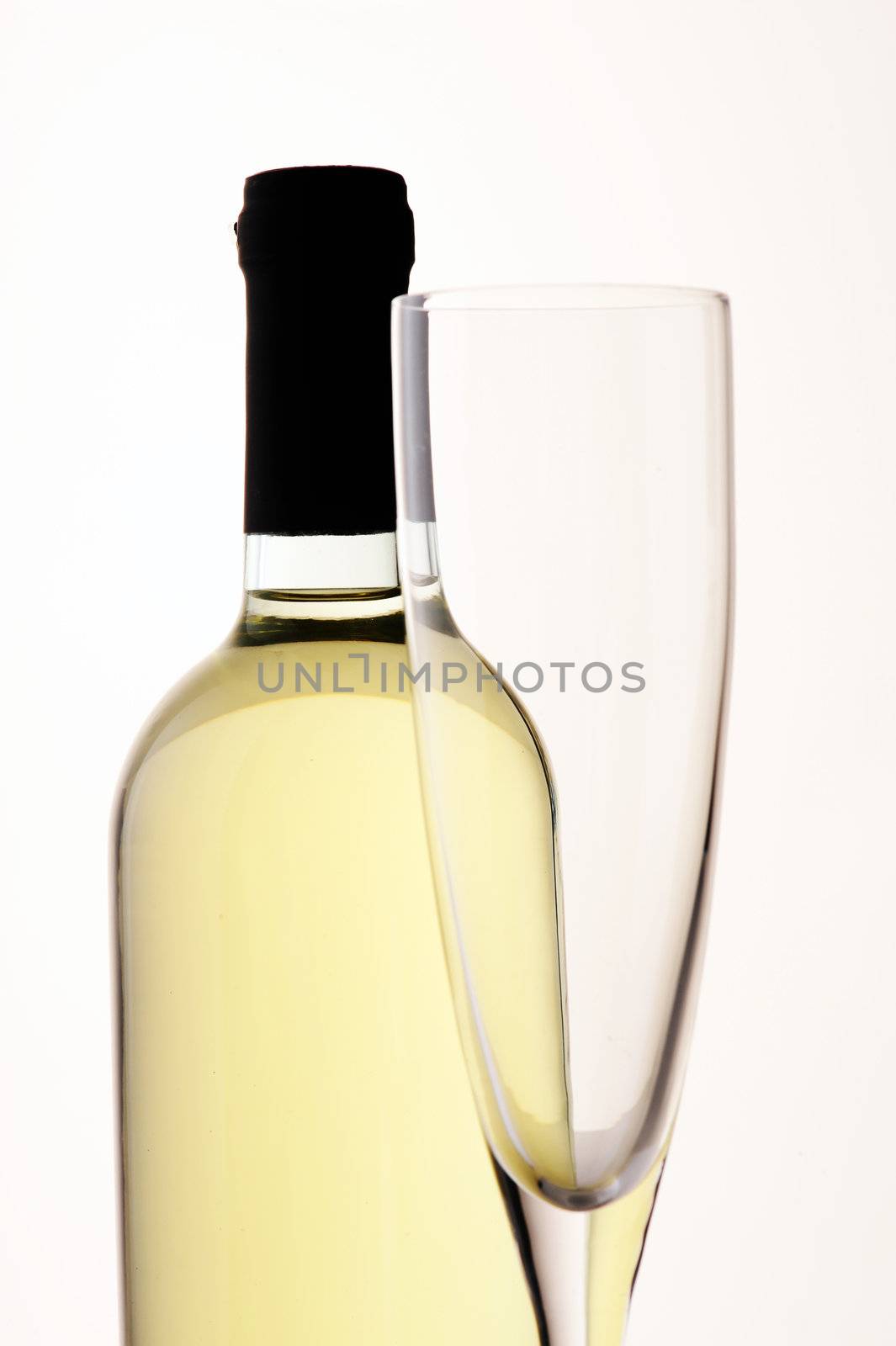 wine bottle and glass by stokkete