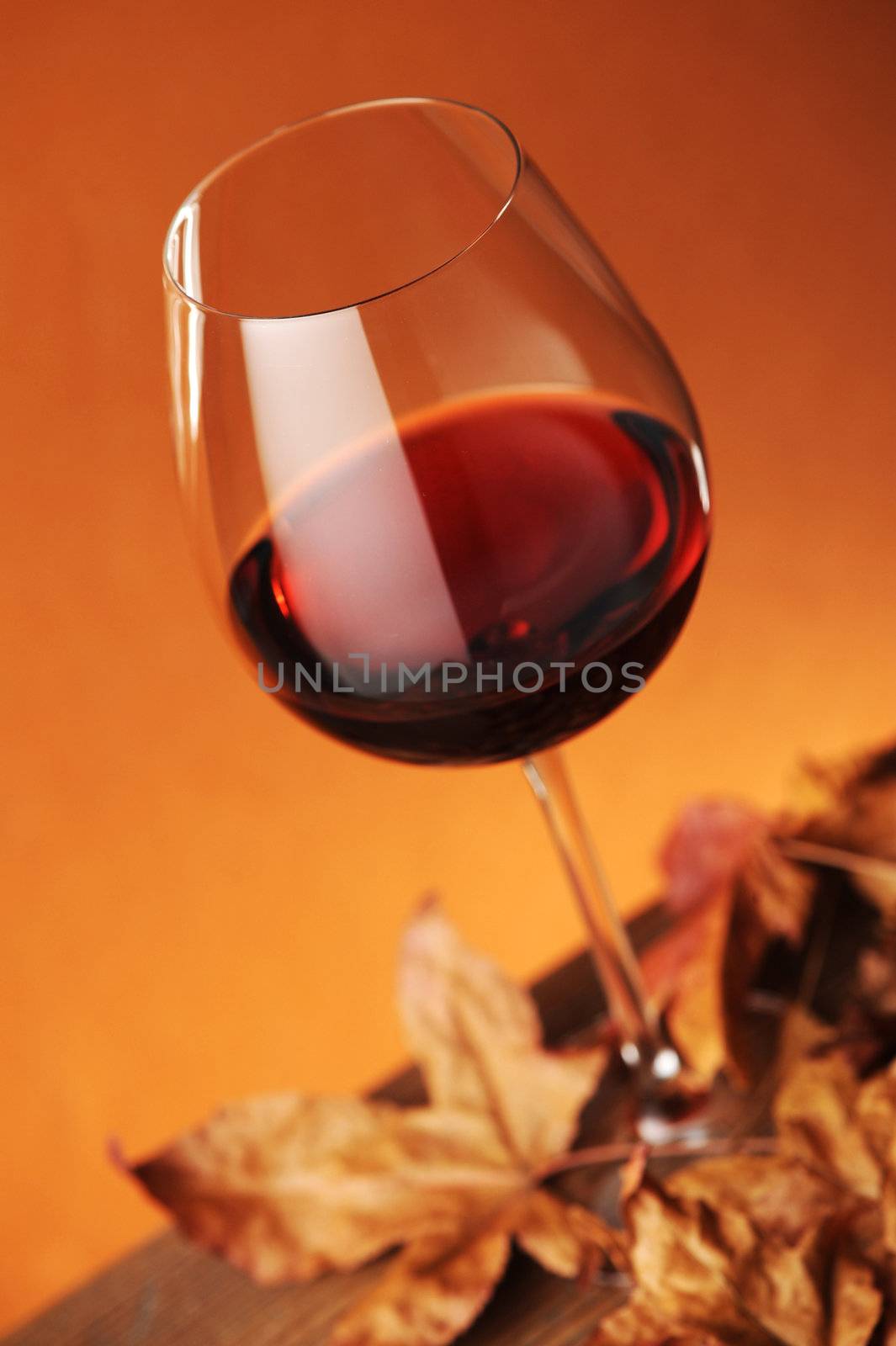 glass of red wine by stokkete