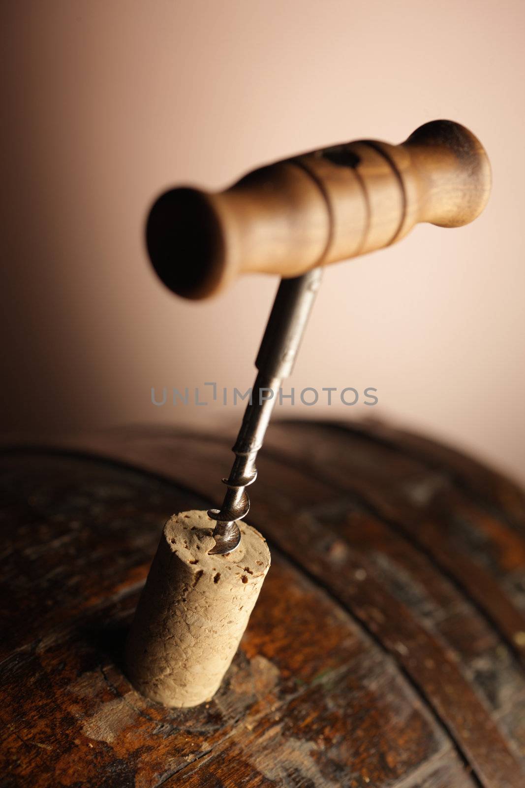 corkscrew and wooden barrel