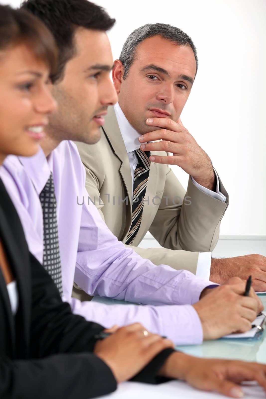 Businessman during meeting by phovoir