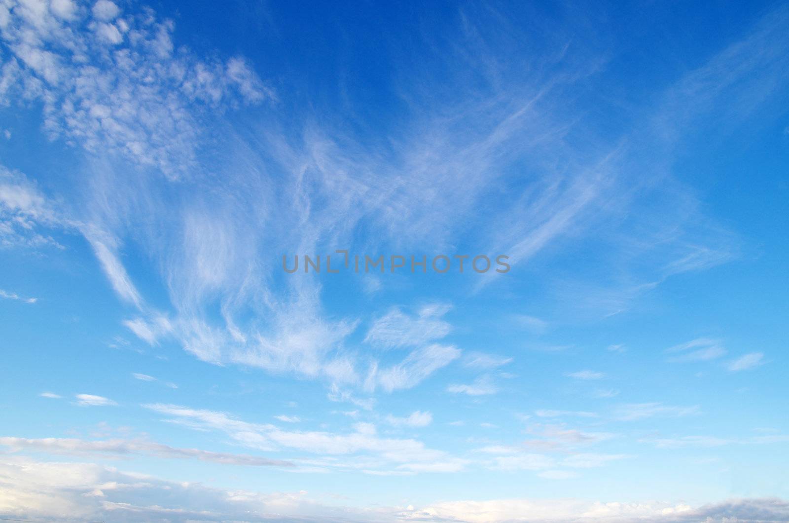 blue sky background with tiny clouds