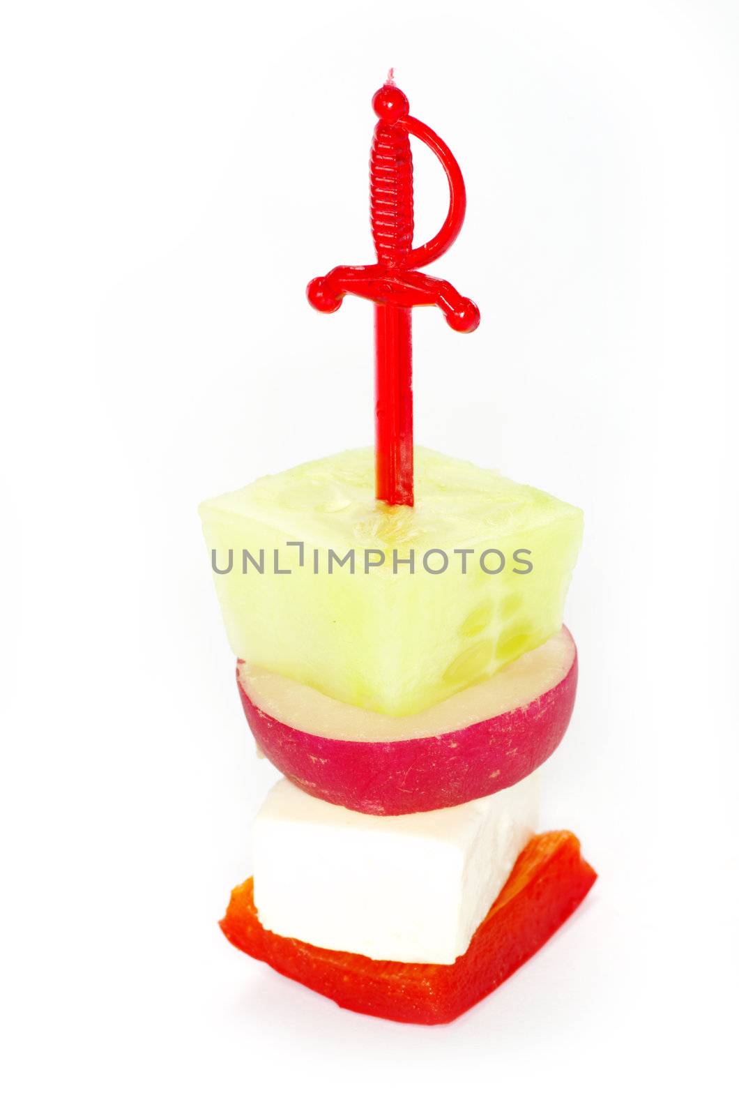 Close-up of canape with olives, cheese and over white
