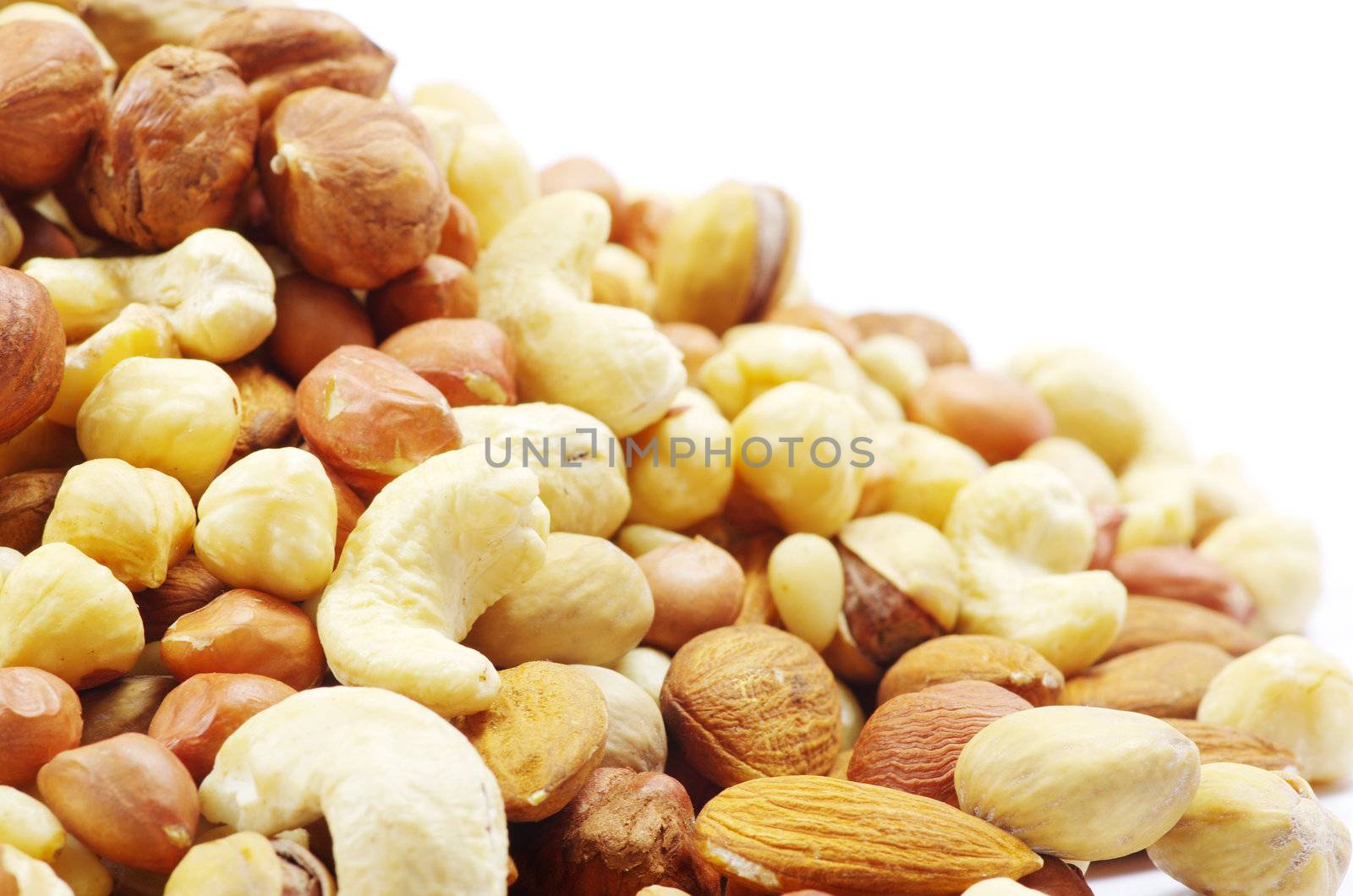 Assorted mixed nuts on white background