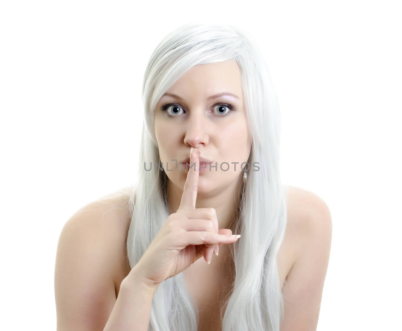 attractive blond girl with a finget at lips isolated on white background