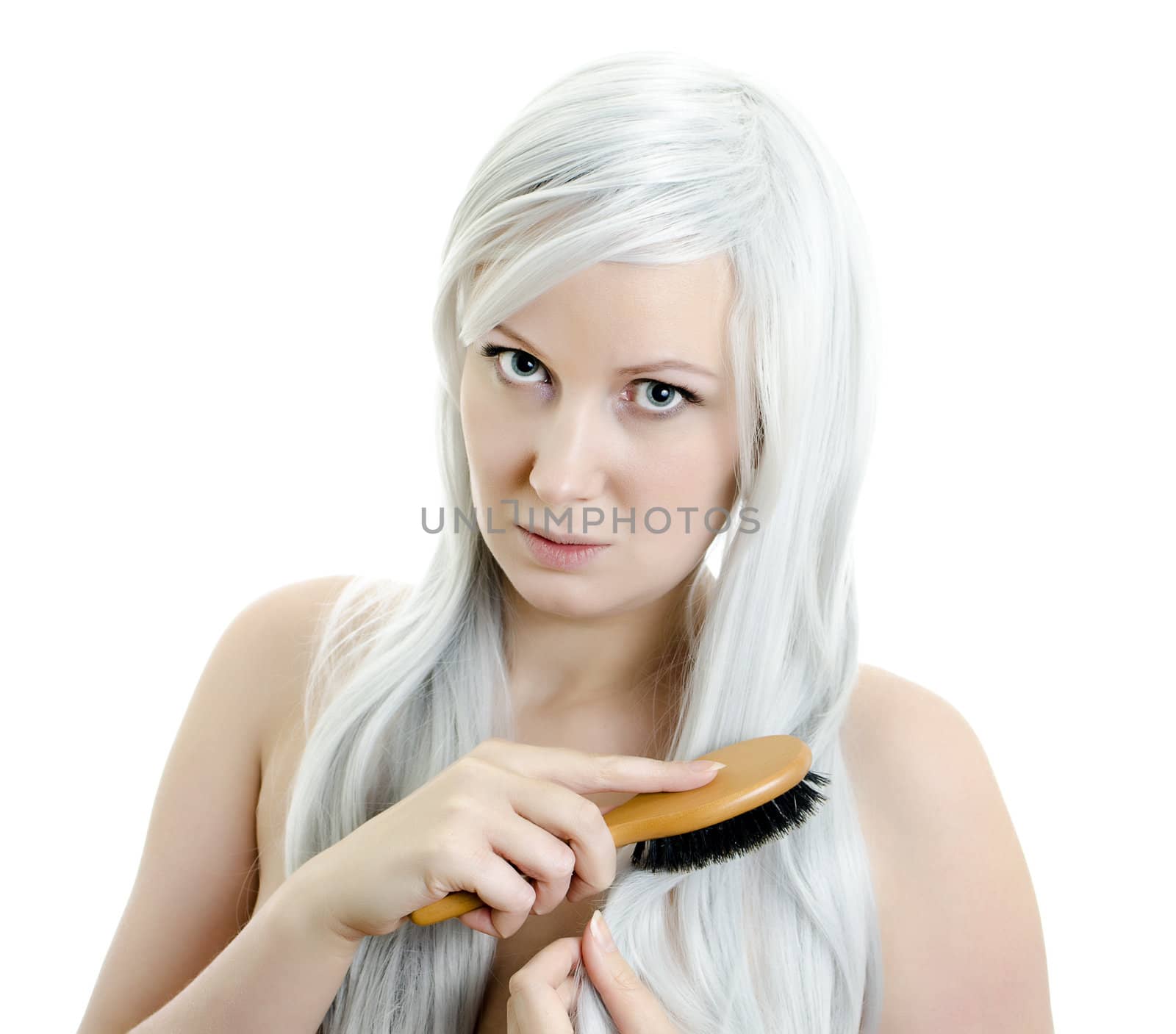 portrait of young girl brushing hair isolated on white