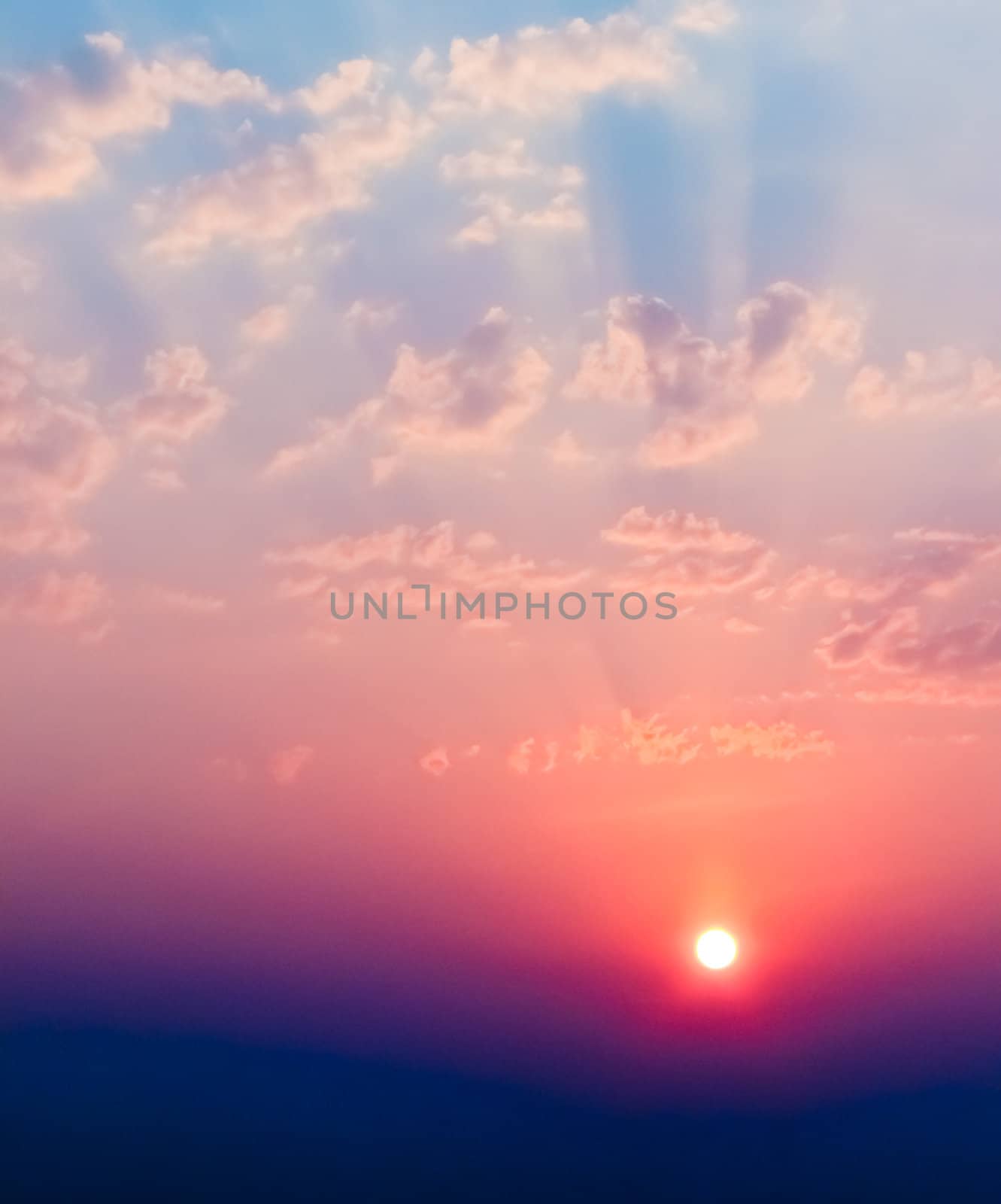 The sun shining over low cloud