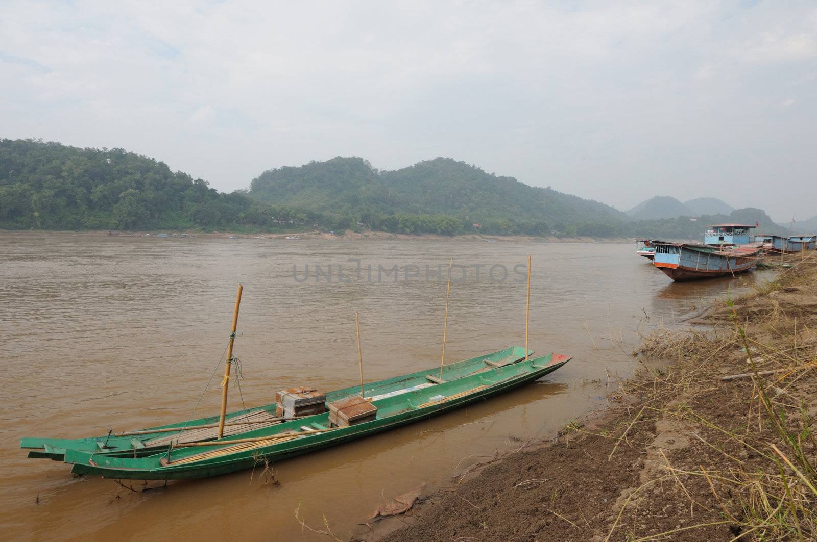 The wooden long tail boats at Mekong river in Luang Phabang, Laos.