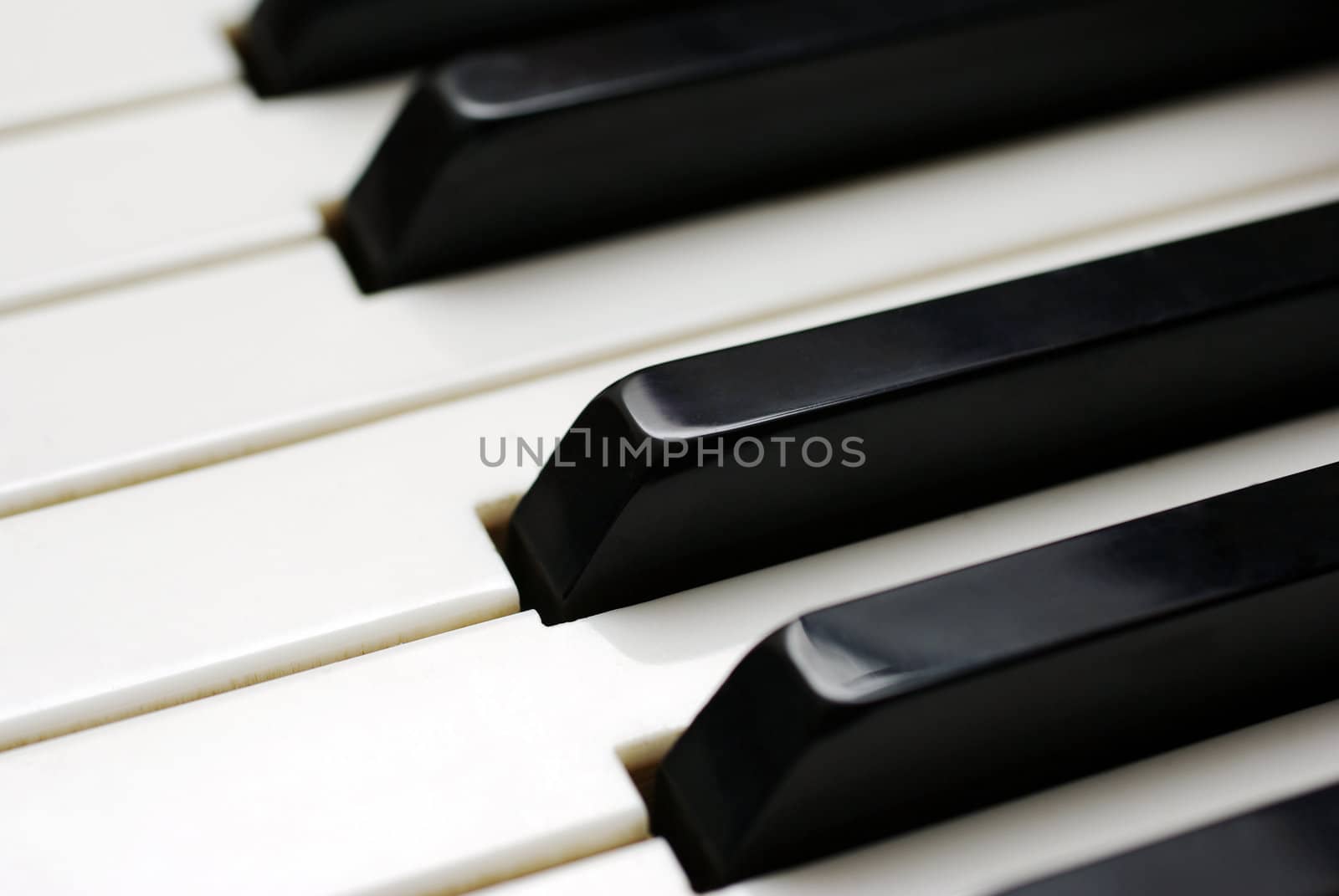 Piano keys. Selective focus close up. by borodaev