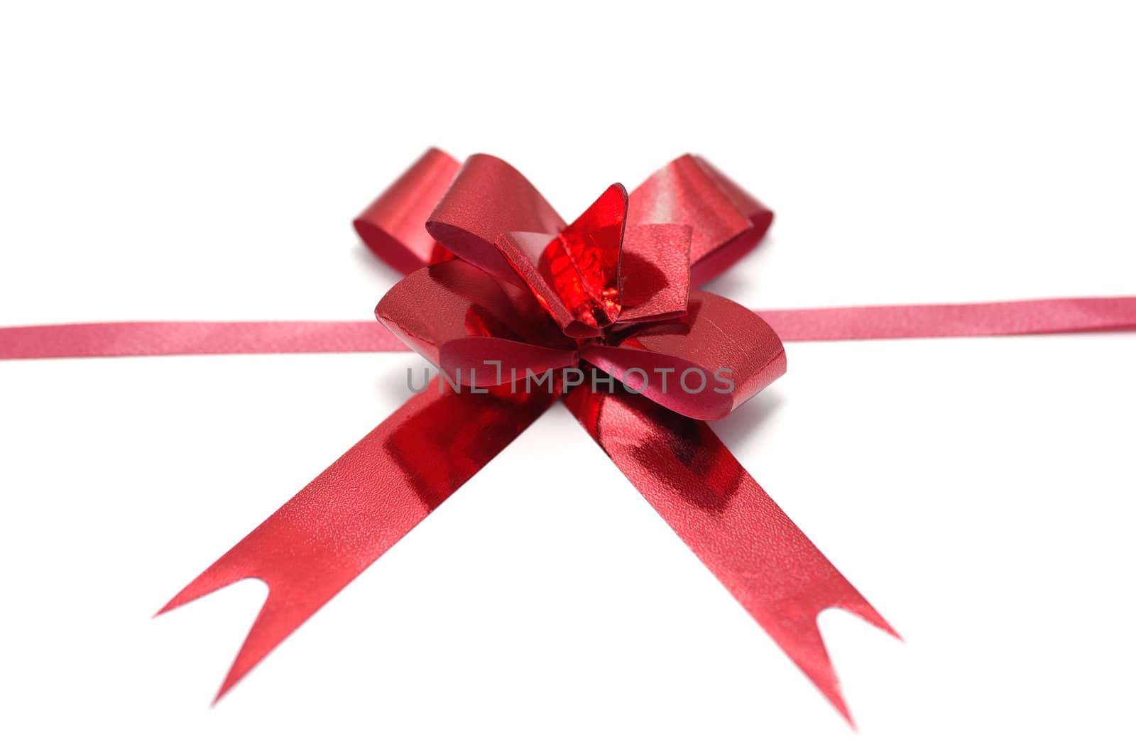 Red ribbon bow isolated on white background. by borodaev