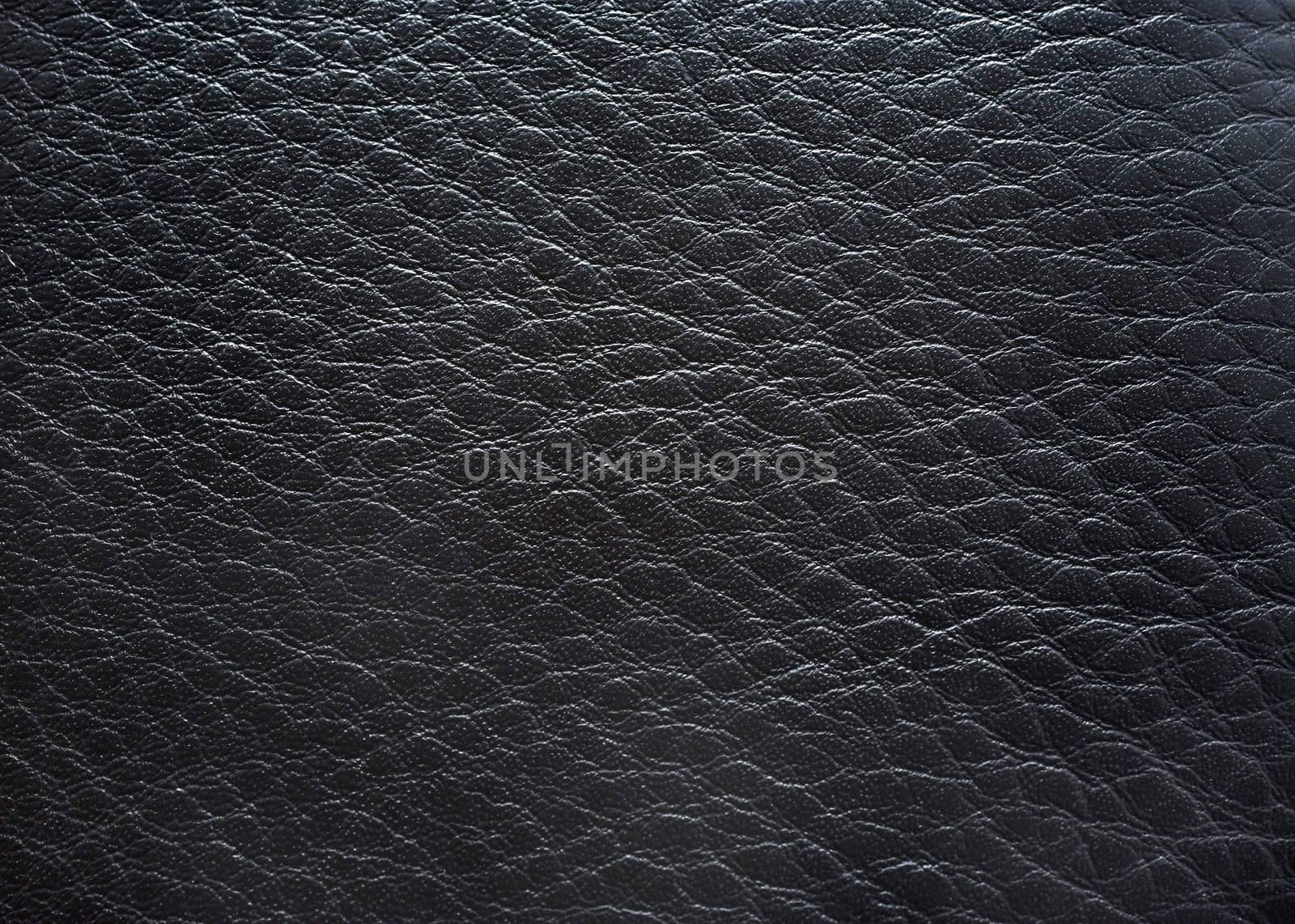 Black leather close up photography as background. by borodaev