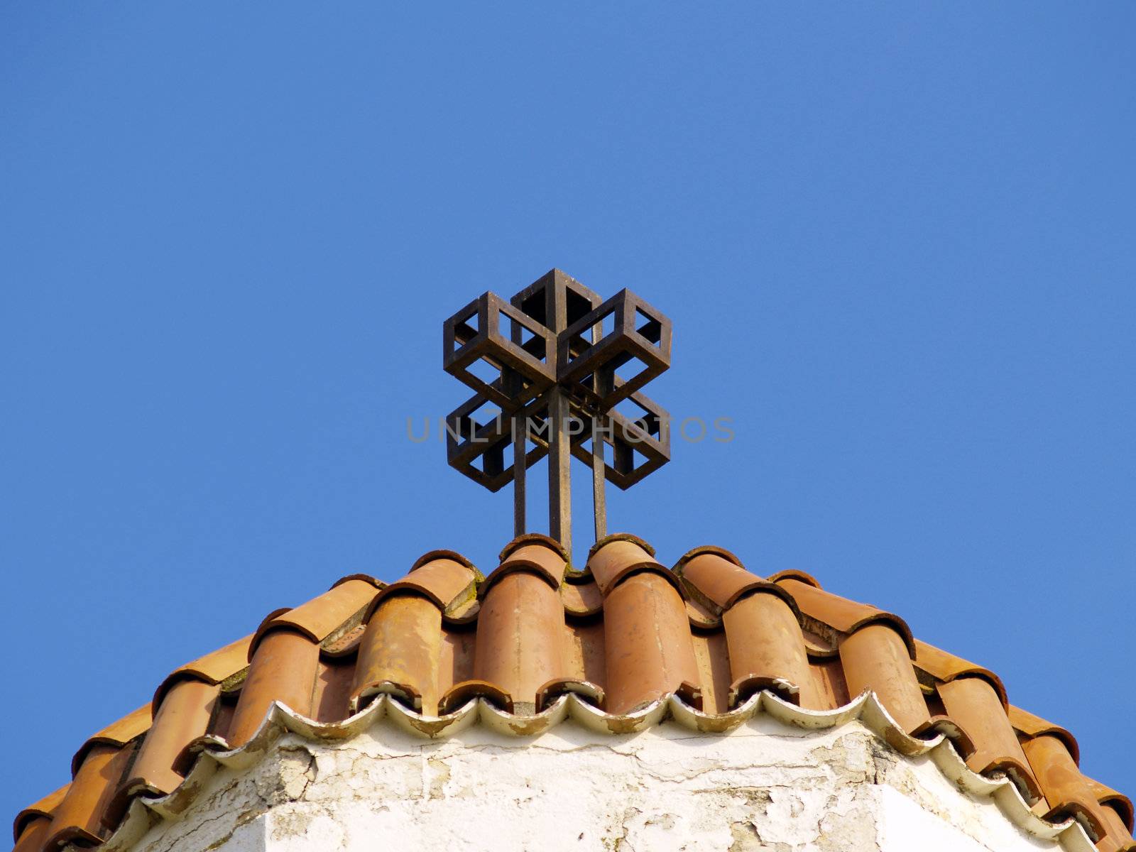 cross ontop a greek church