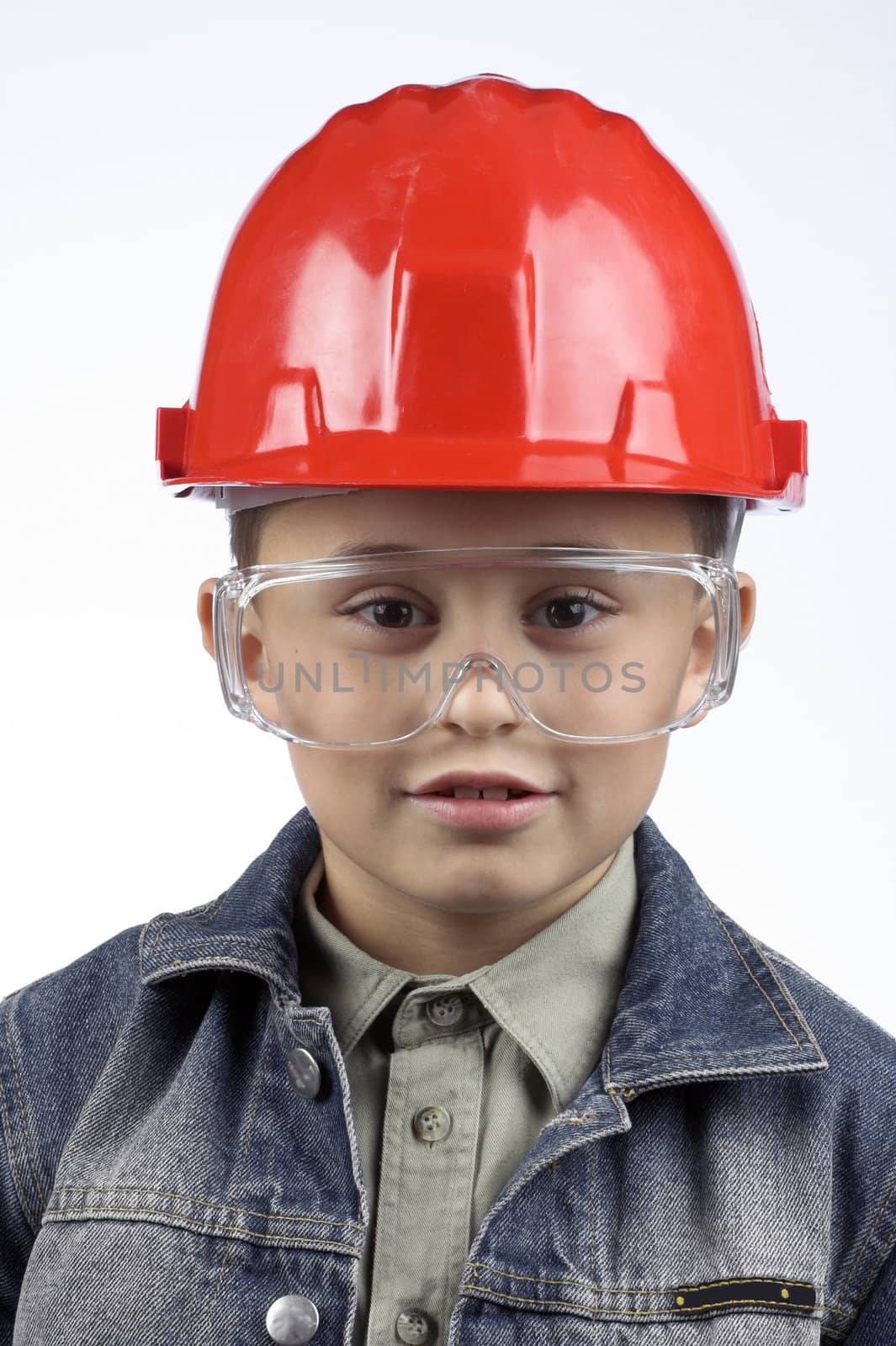 Portrait of a boy in a red protective helmet